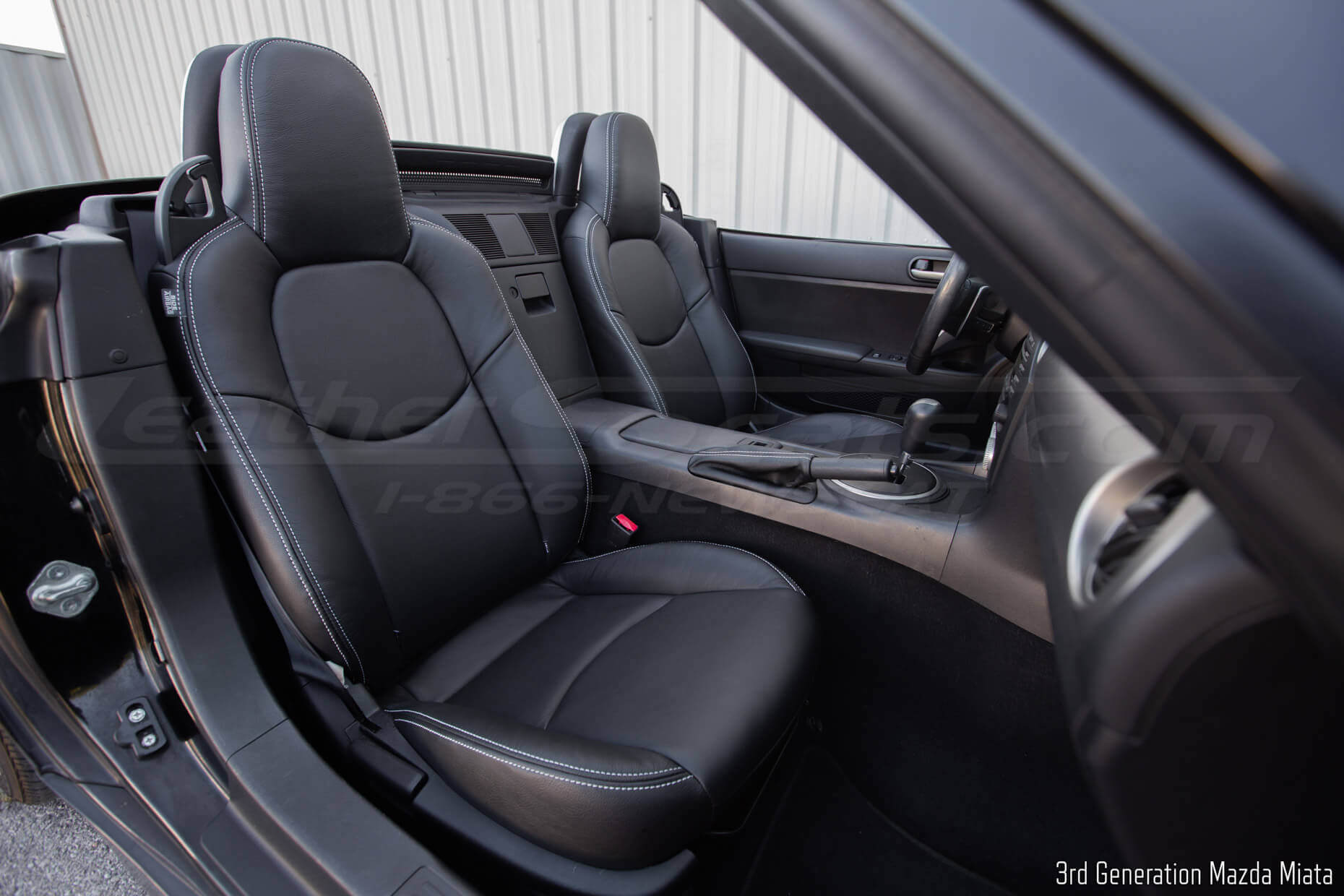 Mazda Miata with aftermarket black leather seats