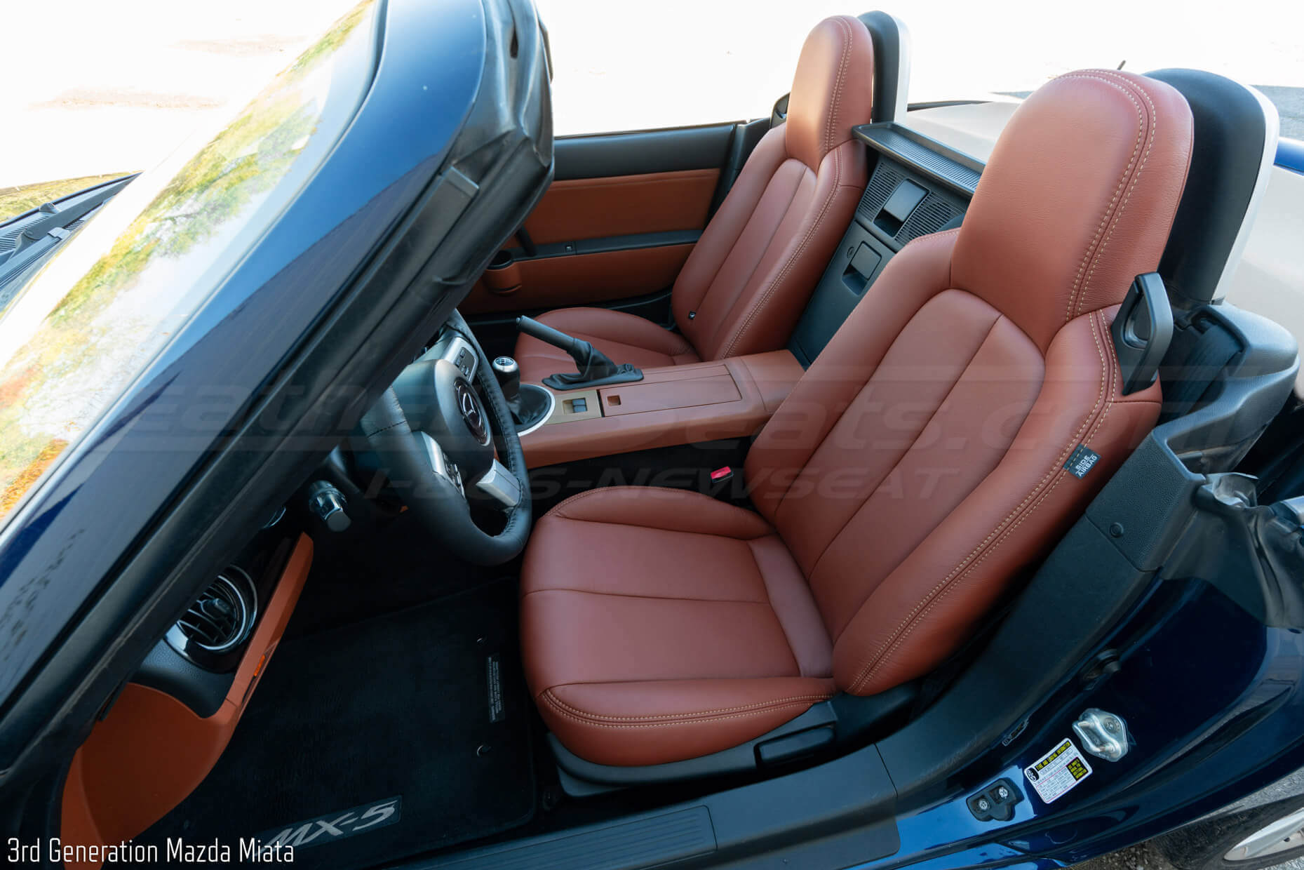 Mazda Miata with custom oem matched leather seats