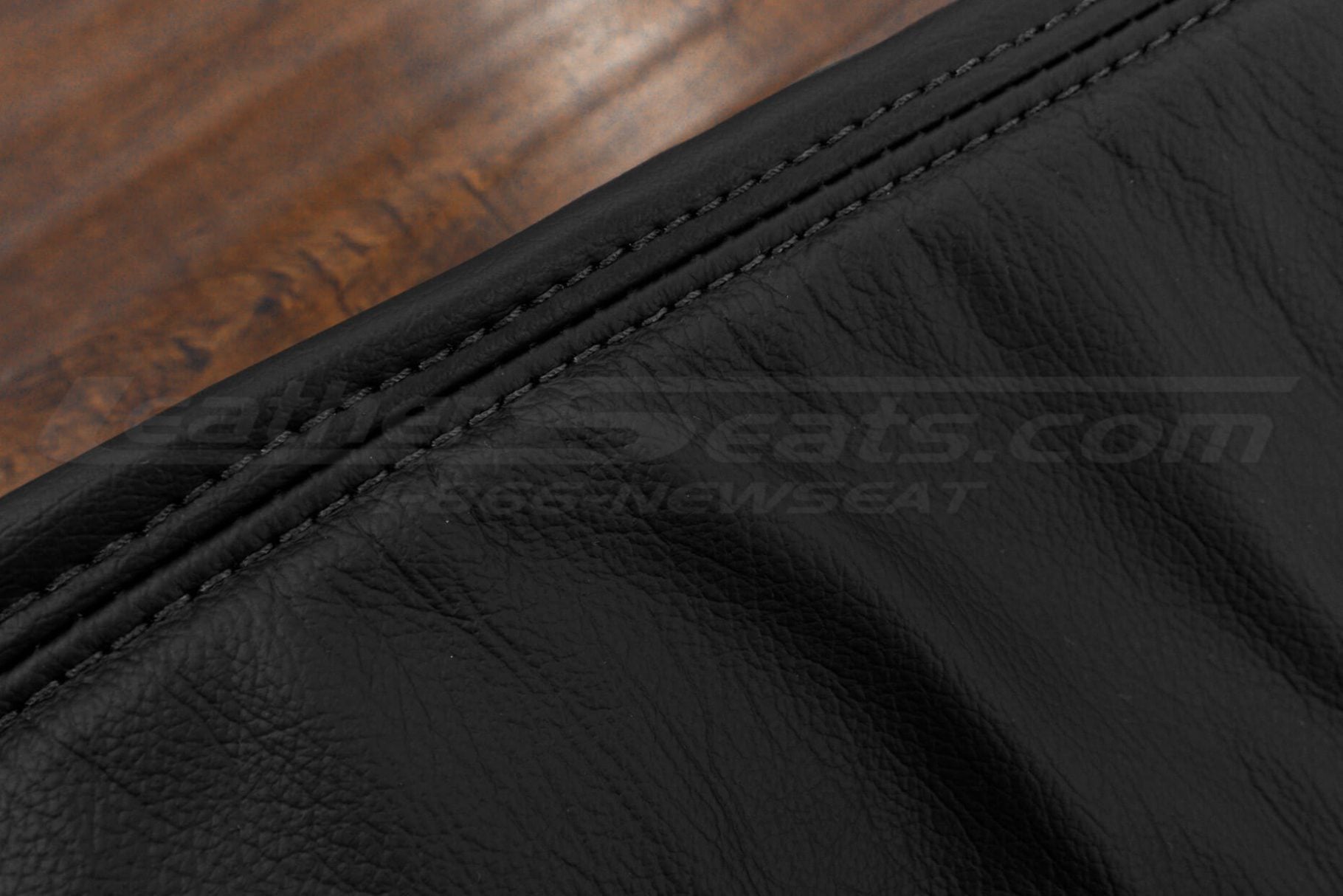 BBlack double-stitching on black matching leather