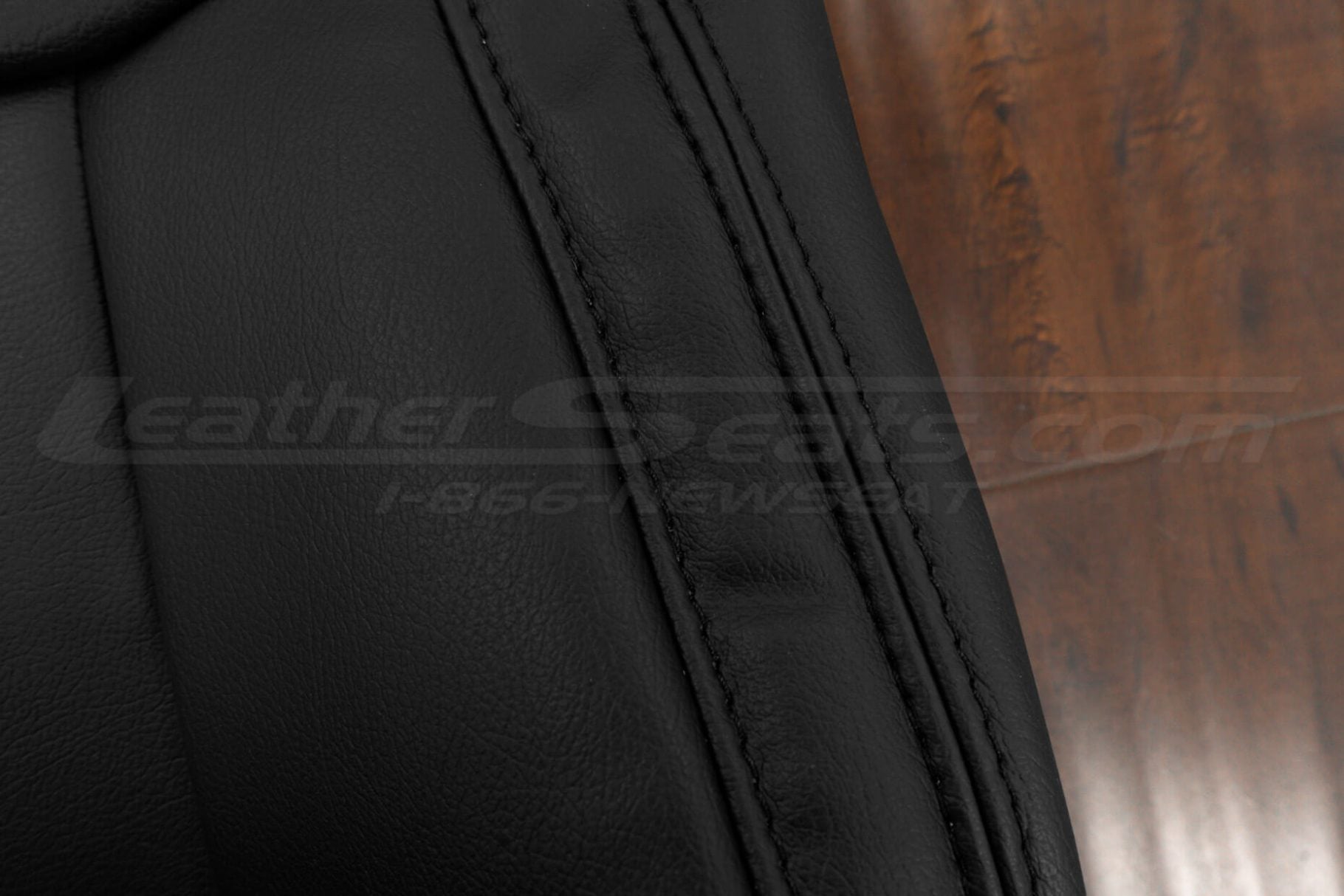 Black stitching on black leather