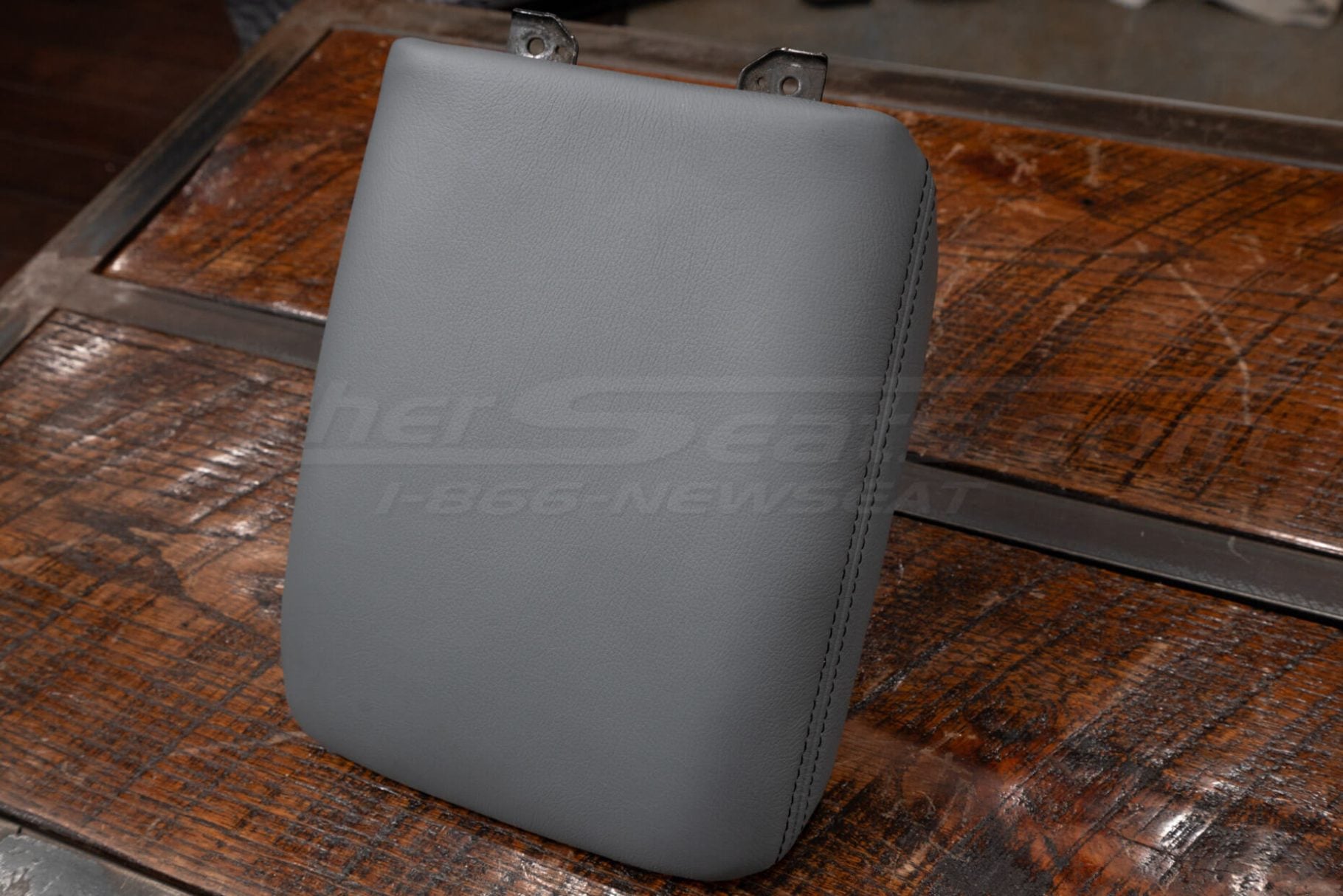 Top-down side view of aftermarket leather console lid cover for Honda Pilot