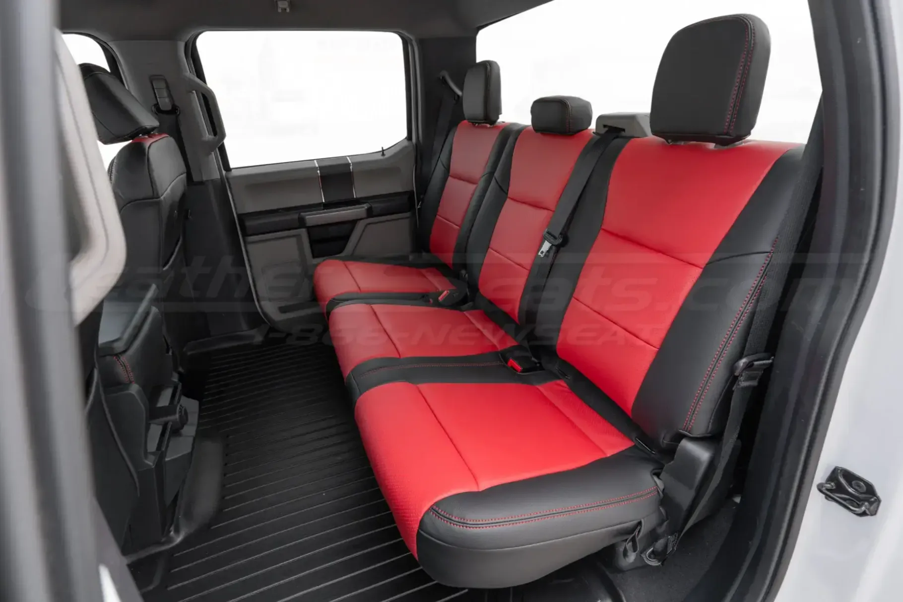 Ford Superduty rear leather seats in two-tone black with red body