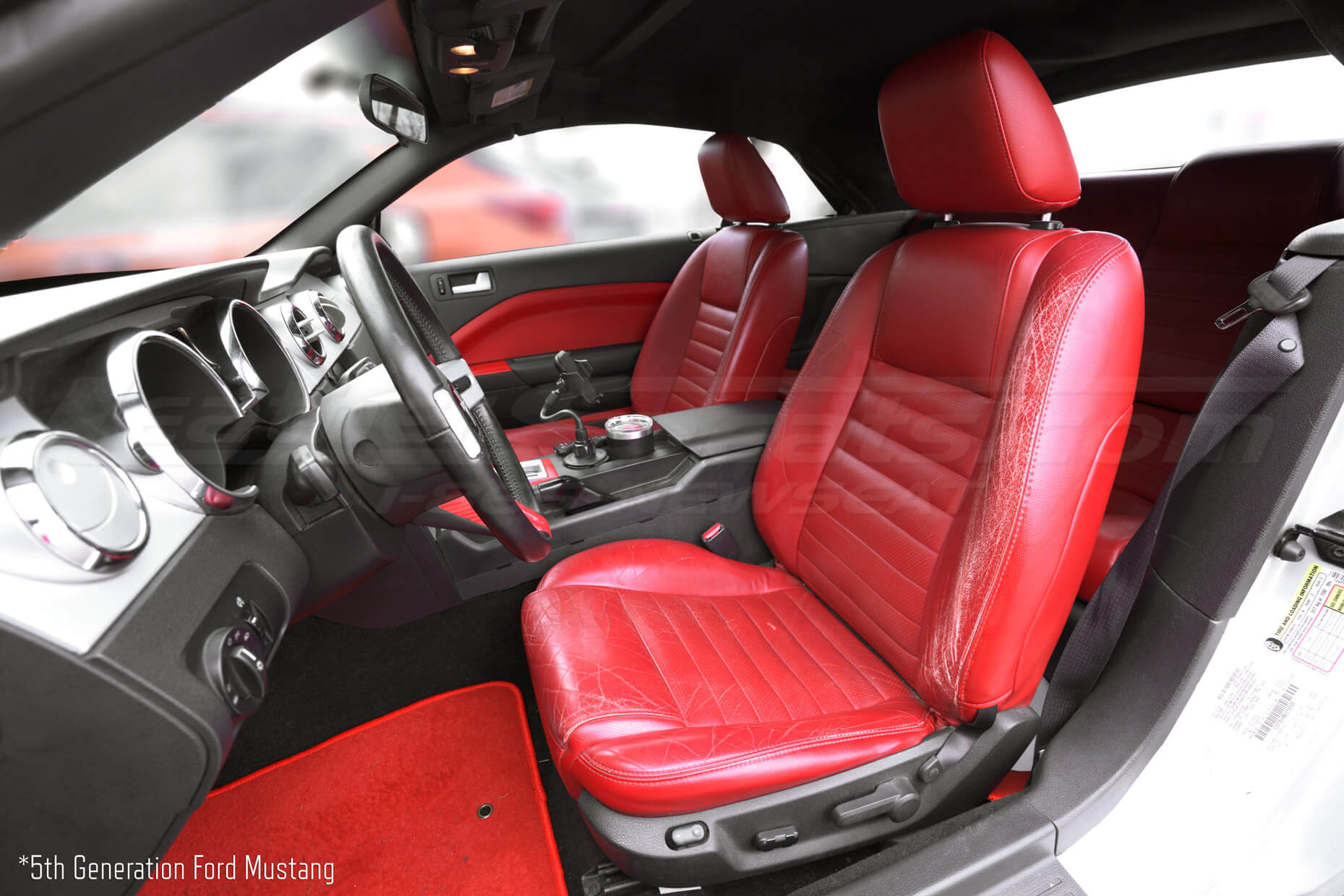 5th Gen Ford Mustang with torn factory leather