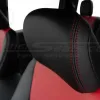 Black leather headrest close-up with contrast red double stitching