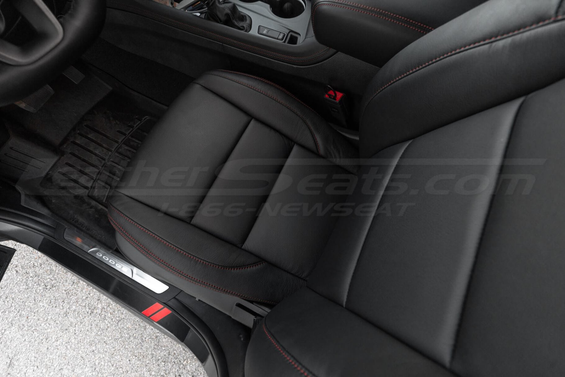 Top down view of aftermakret leather seats in Black with Red stitching