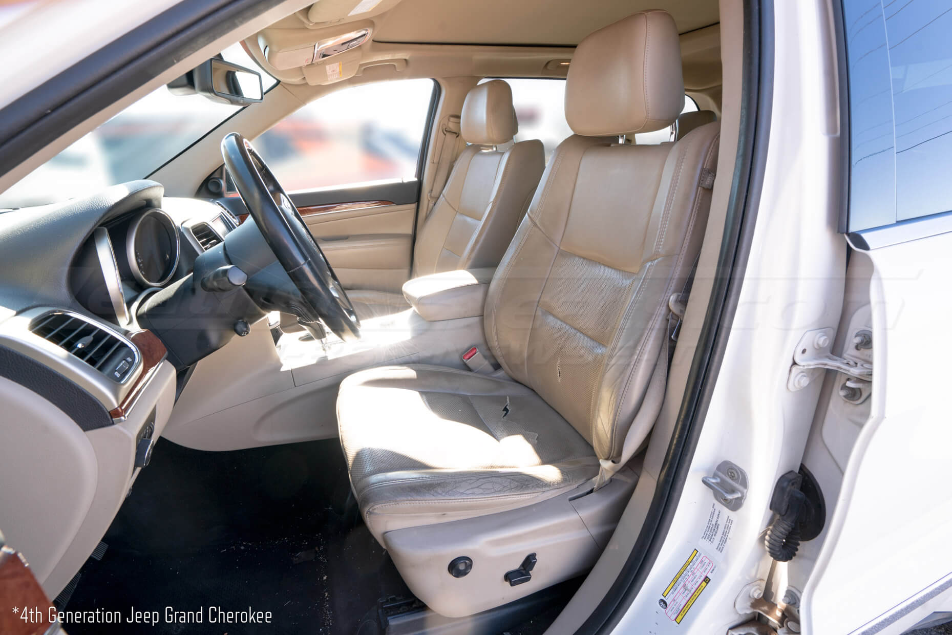 Jeep Grand Cherokee with torn factory leather
