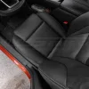 Top-down view of black Nissan Rogue leather seats with perforated body sections
