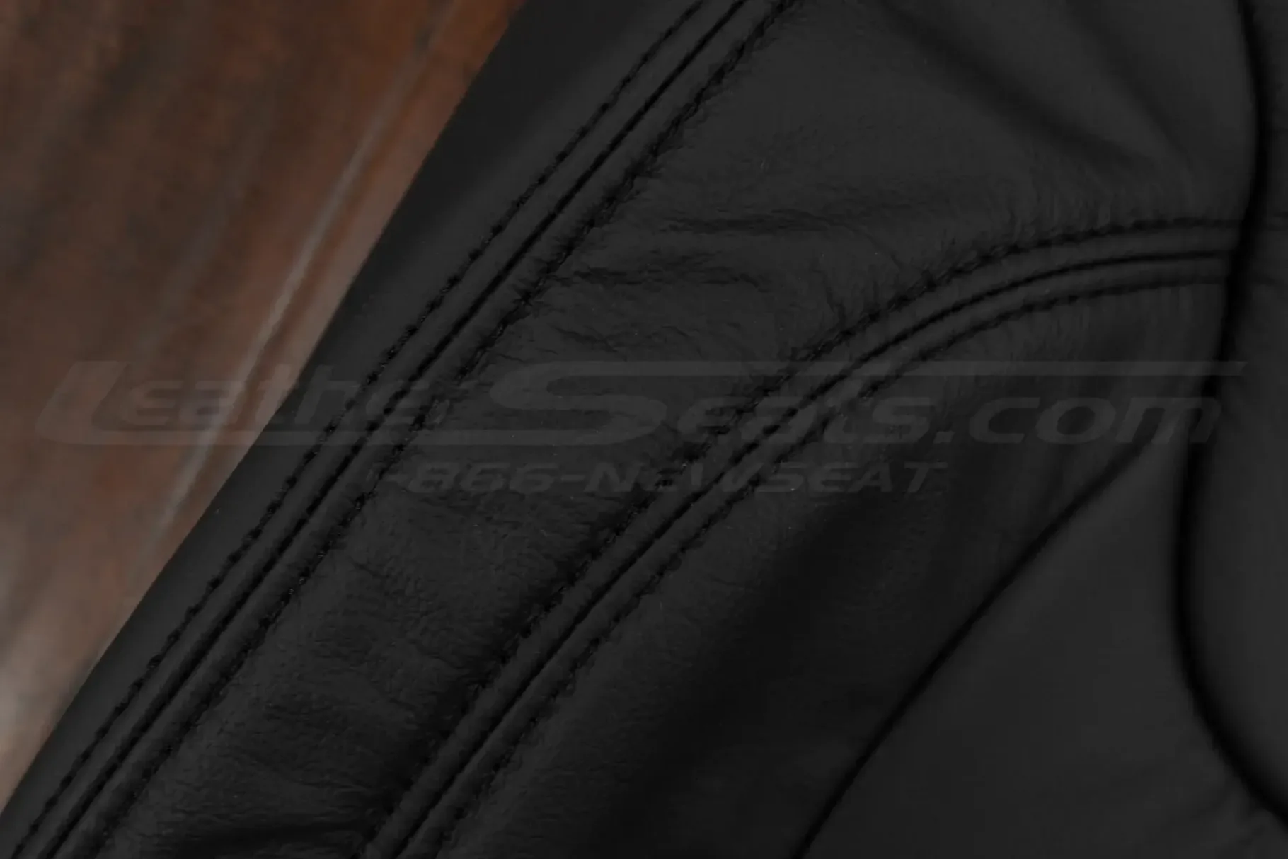Black double-stitching on matching black leather