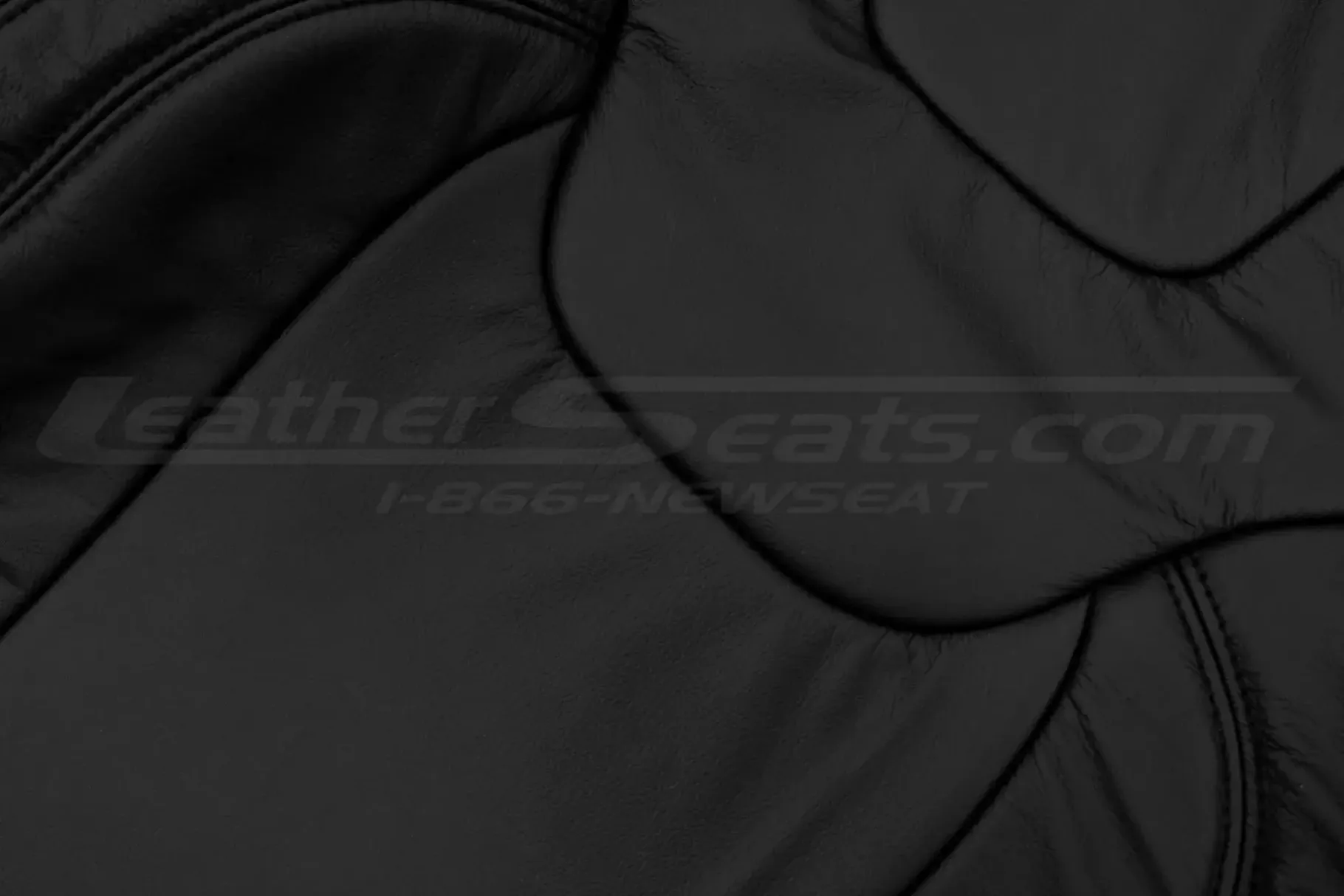 Black automotive grade leather texture close-up