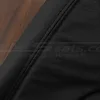 Black double-stitching on black leather