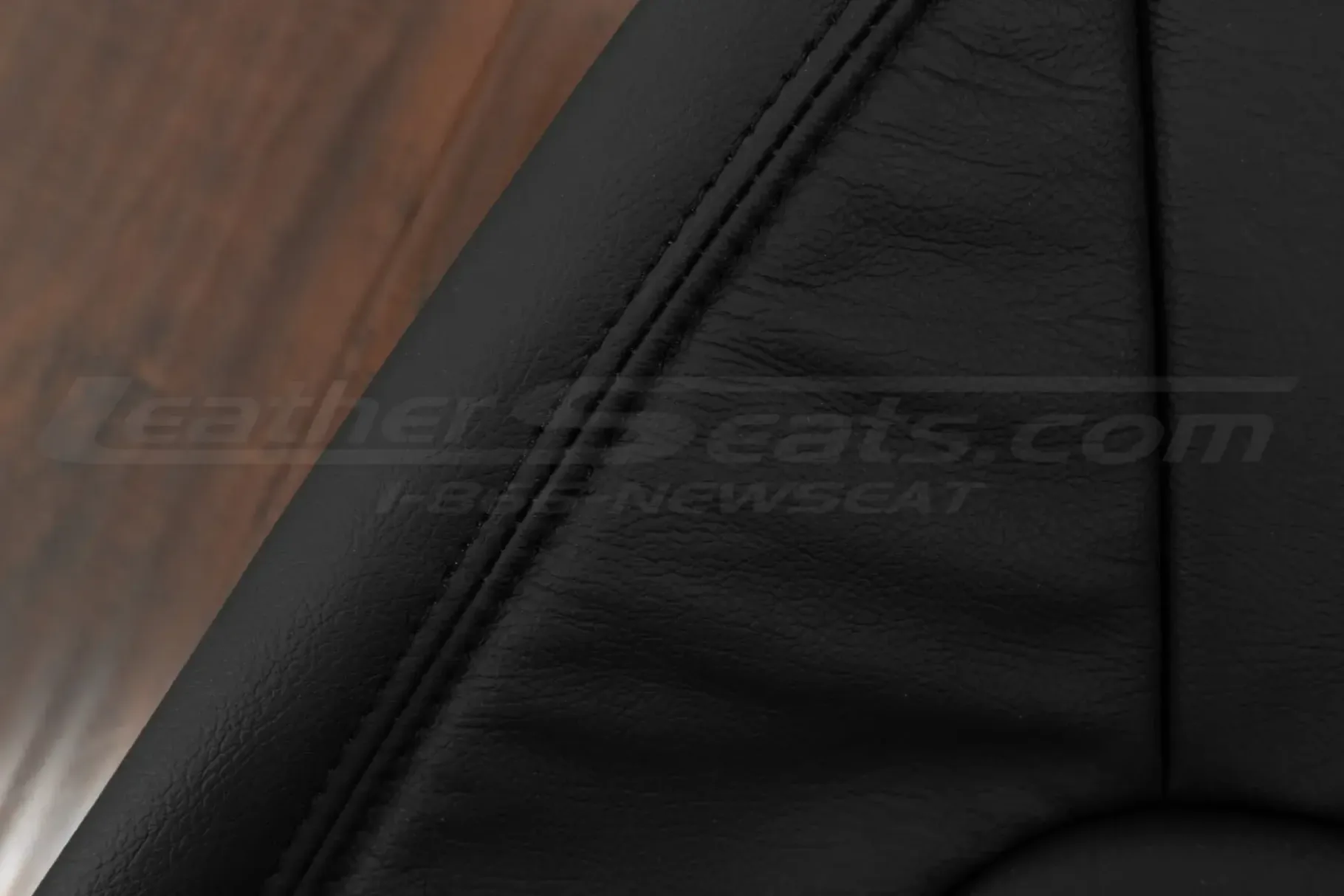 Black double-stitching on black leather