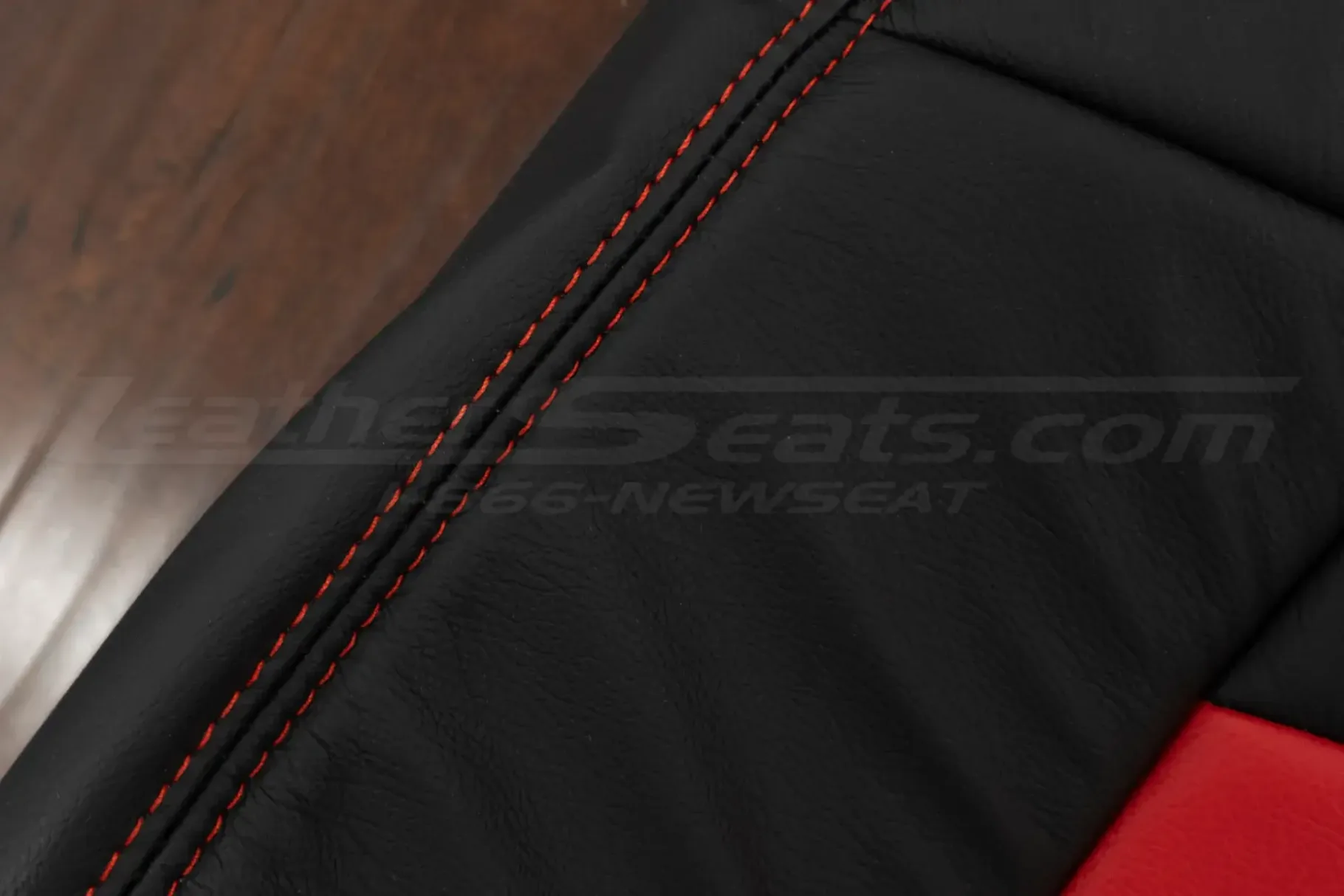 Bright Red double-stitching on black leather