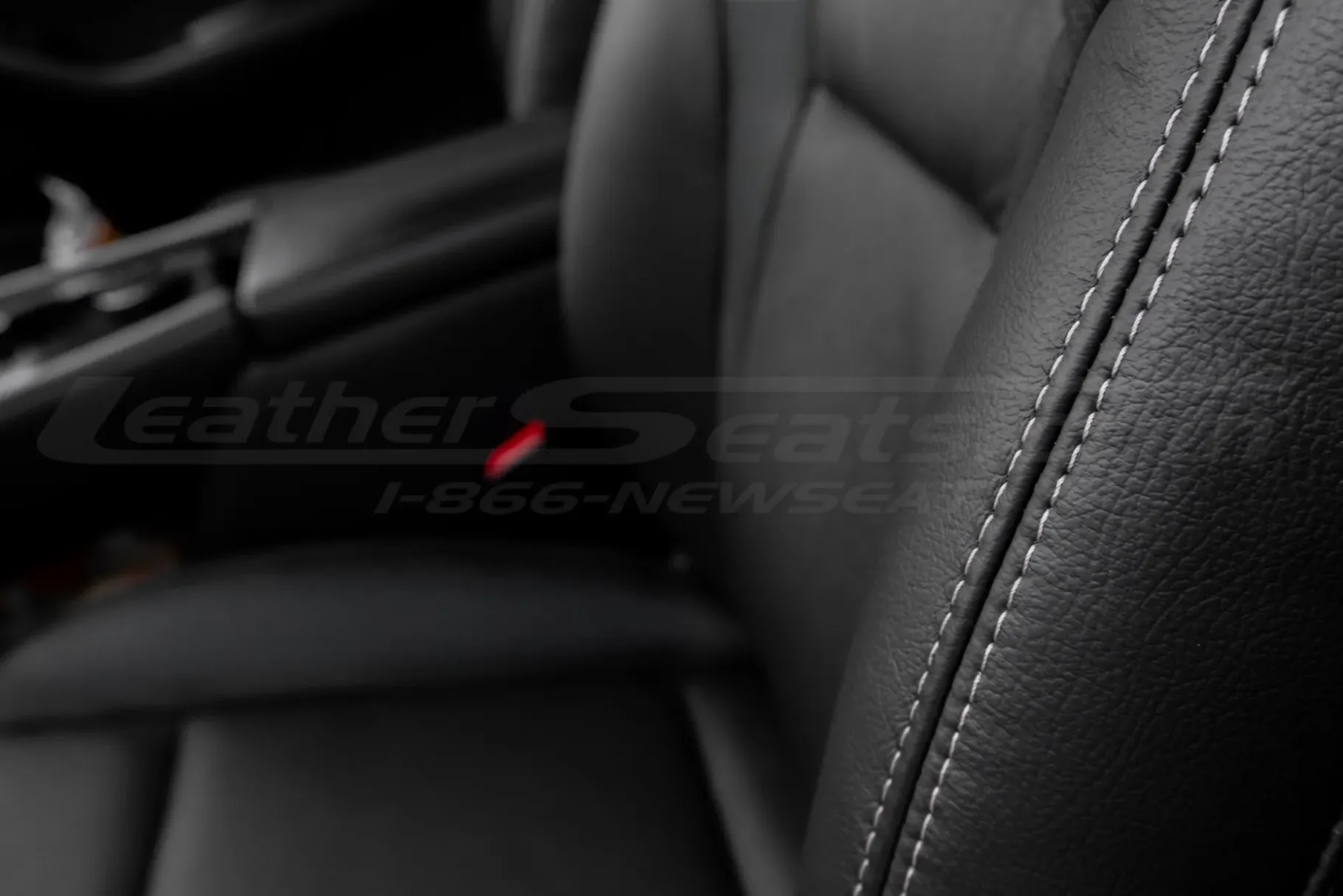Contrasting Fawn double-stitching on black leather