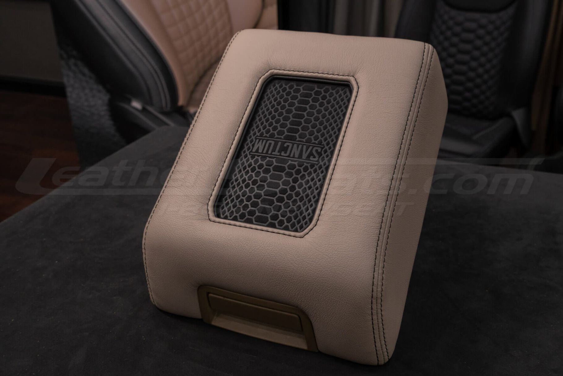 Adobe leather phone charging center console with black double stitching and black trim ring