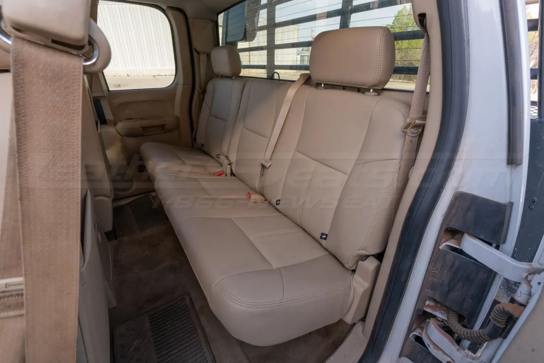 Aftermarket leather upholstery for GMC Sierra installed- rear seats driver side