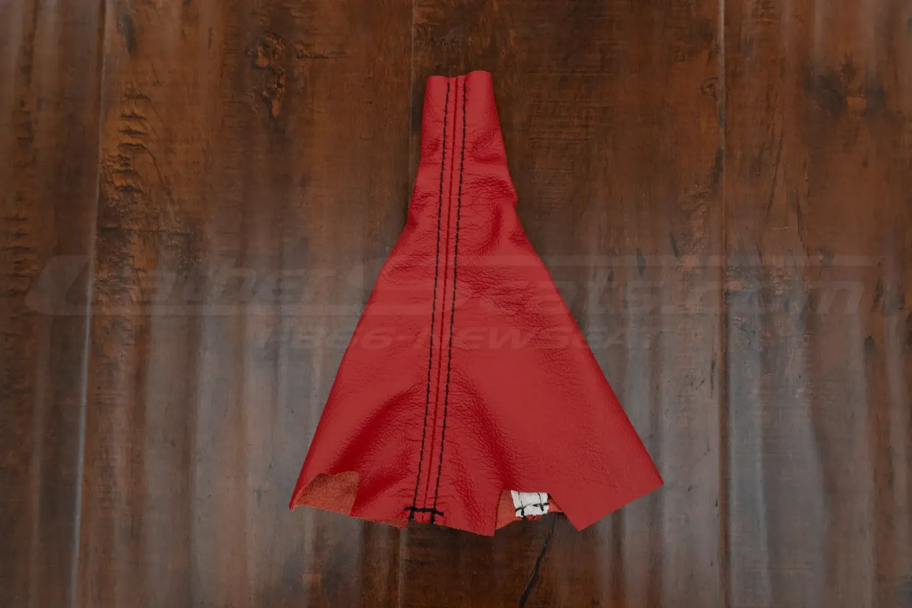 Top-down flat lay of custom replacement leather shift boot cover for honda civic