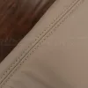 Ivory double-stitching on matching ivory leather