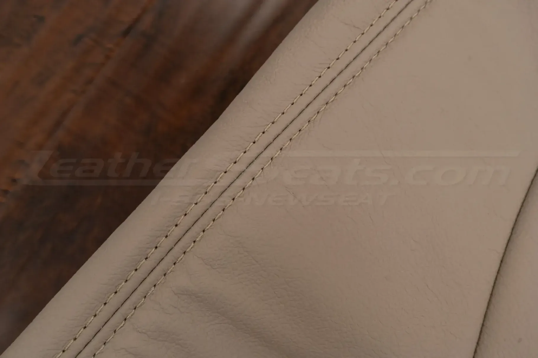 Ivory double-stitching on matching ivory leather