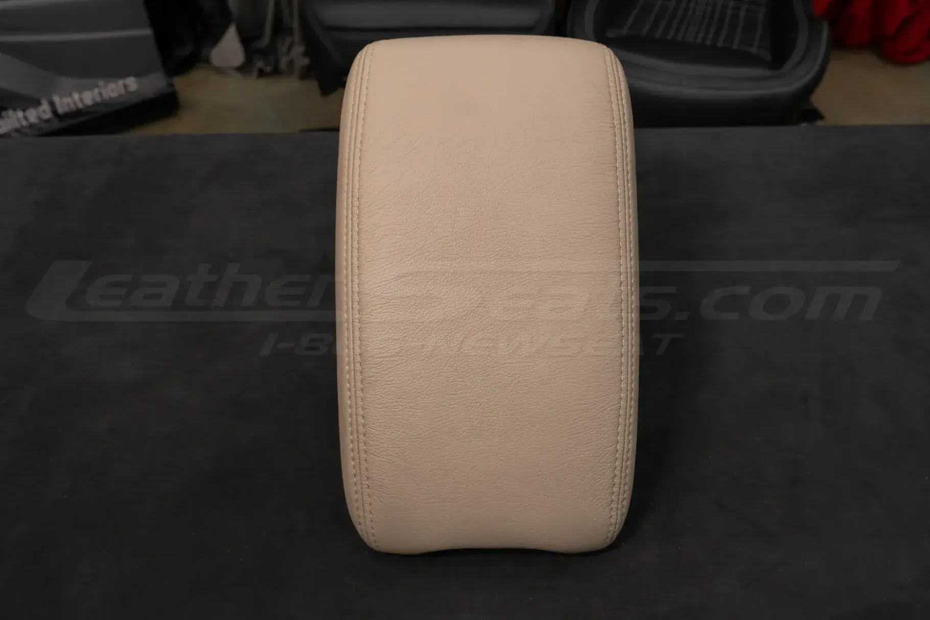 Front view of aftermarket leather center console lid cover