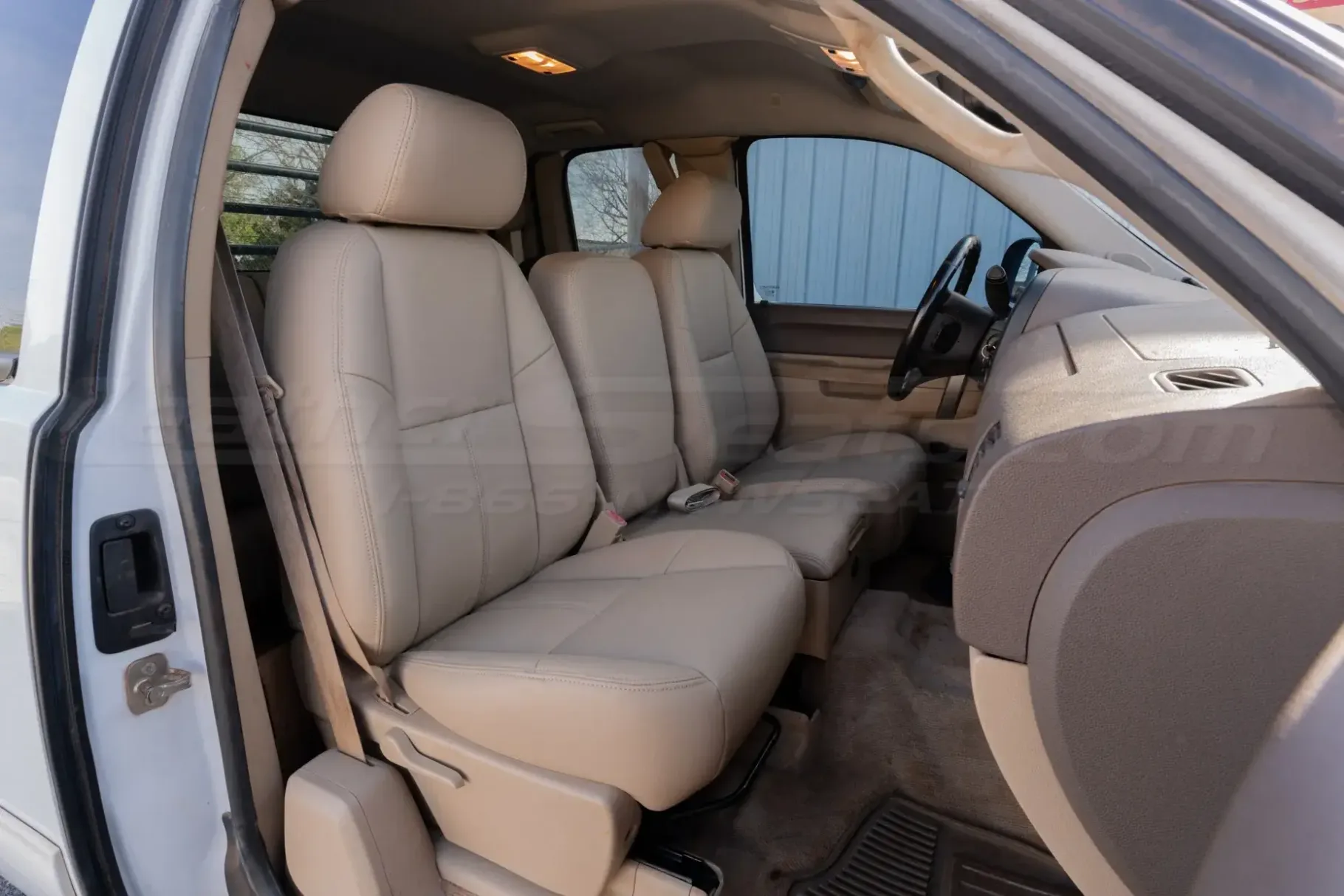 Passenger side of Chevy Silverado with aftermarket leather seats installed