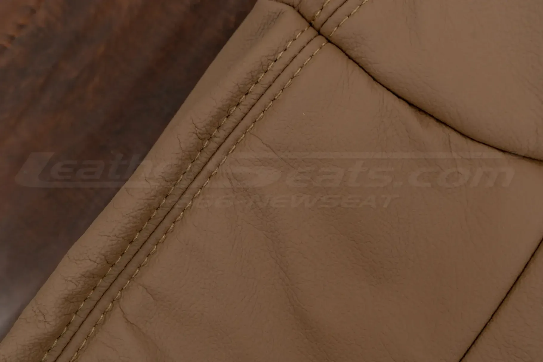 Matching teak double-stitching on teak leather