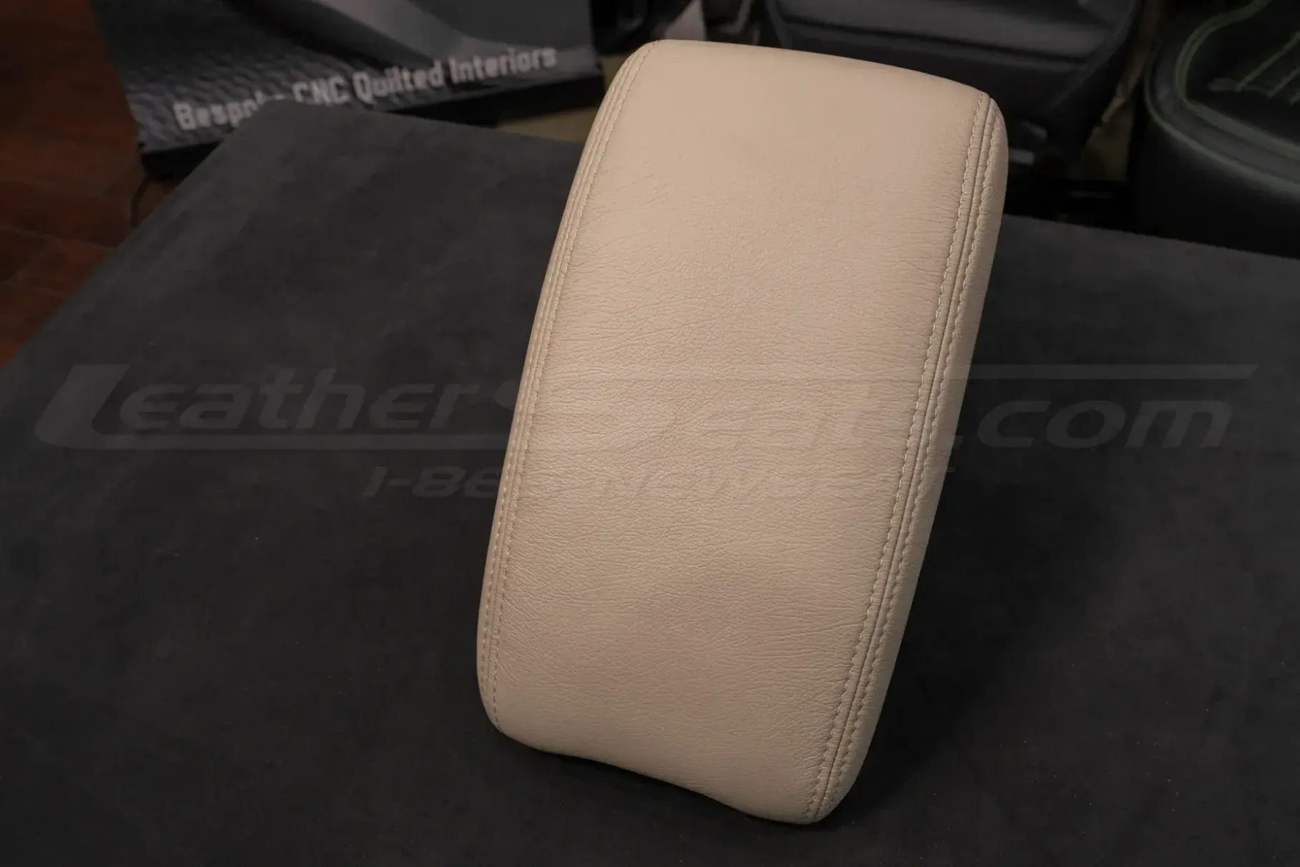 Top-down side view of aftermarket leather console cover for lexus lx470