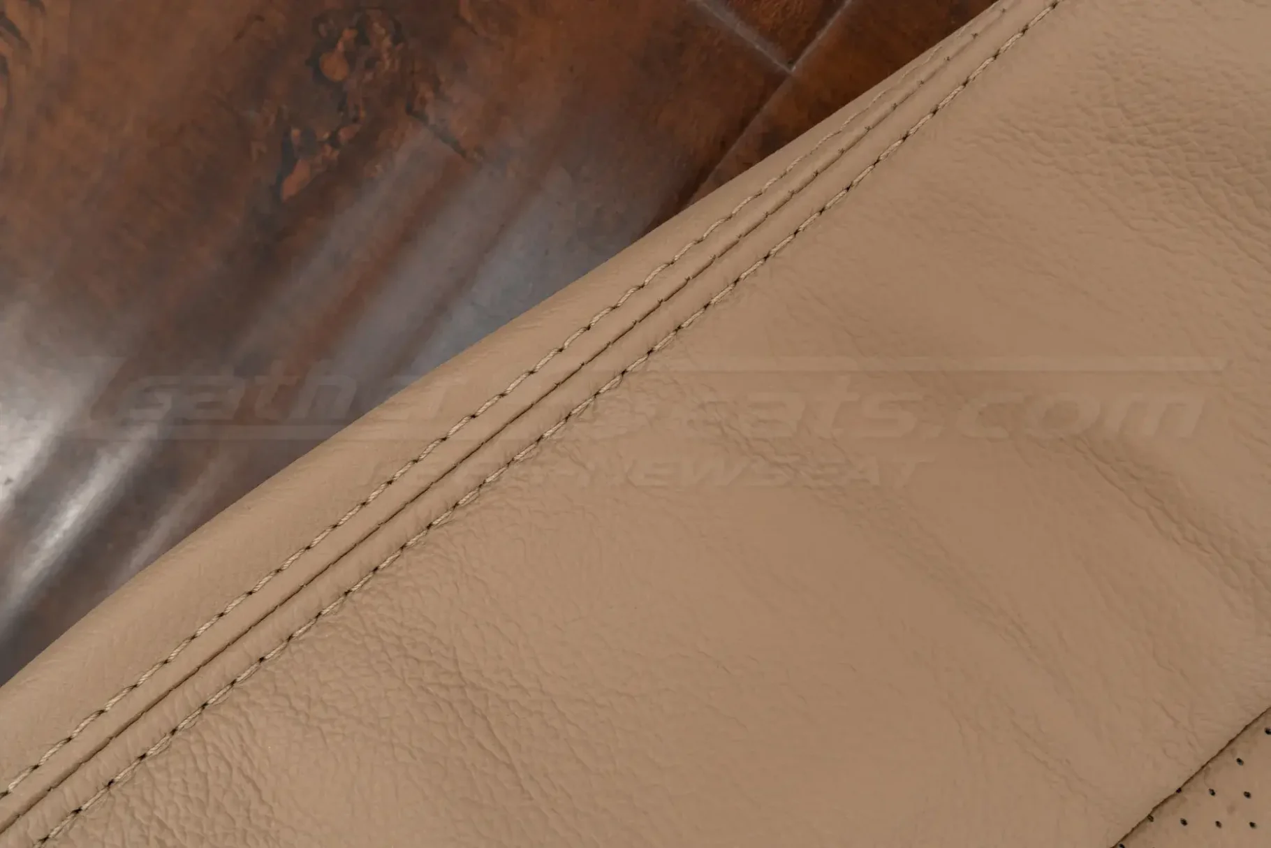 Bisque double-stitching on matching bisque leather