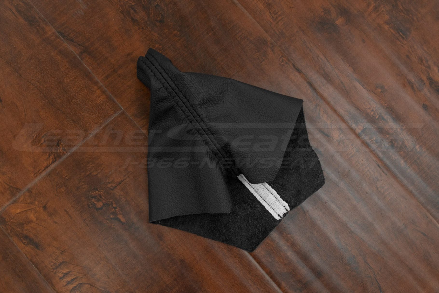 Side flat lay of black leather shift boot cover