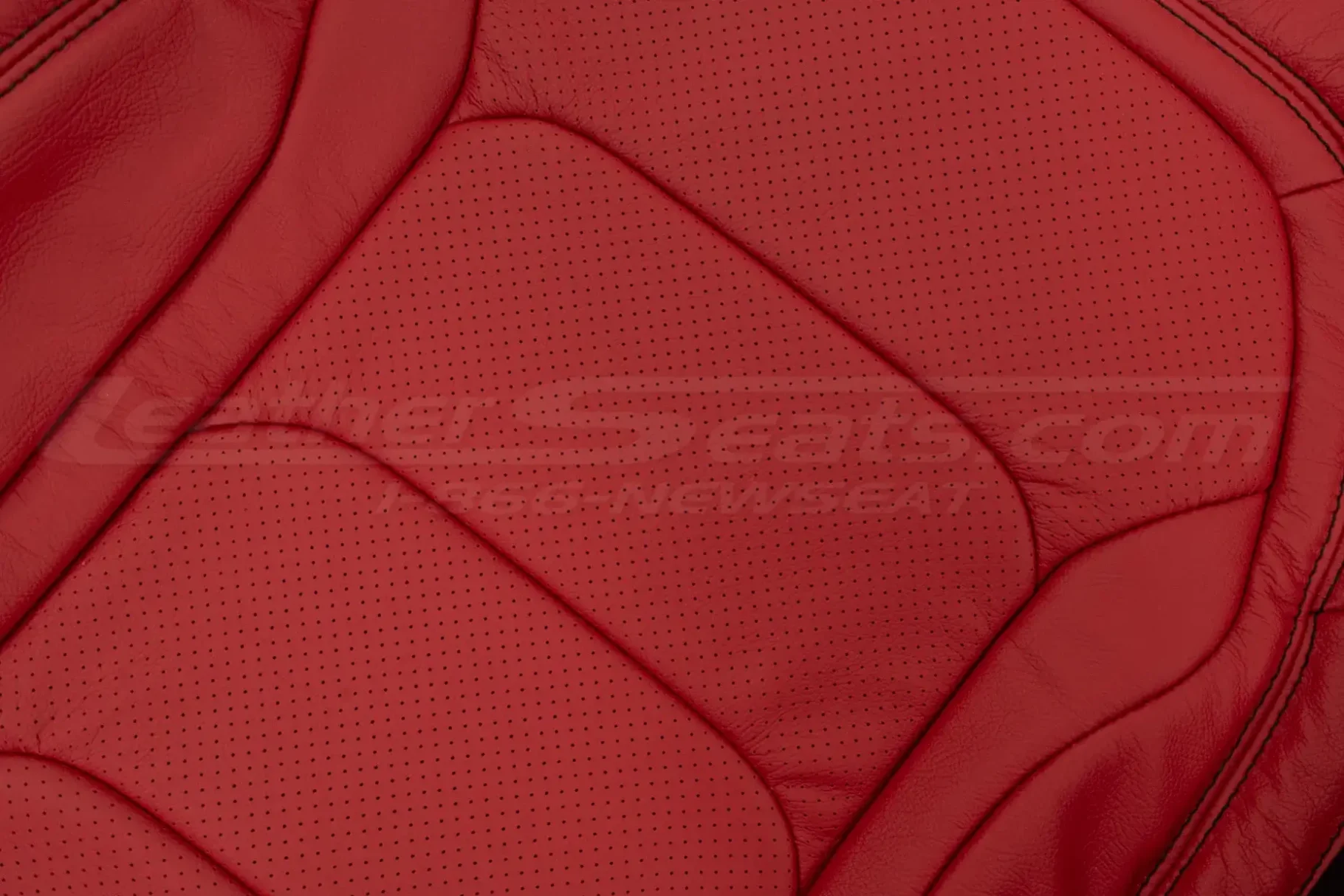 Red perforrated leather close-up