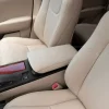 Aftermarket front center armrest cover installed in vanilla leather