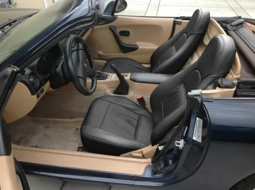 1999-2000 Mazda Miata Roadster aftermarket black leather seats - featured