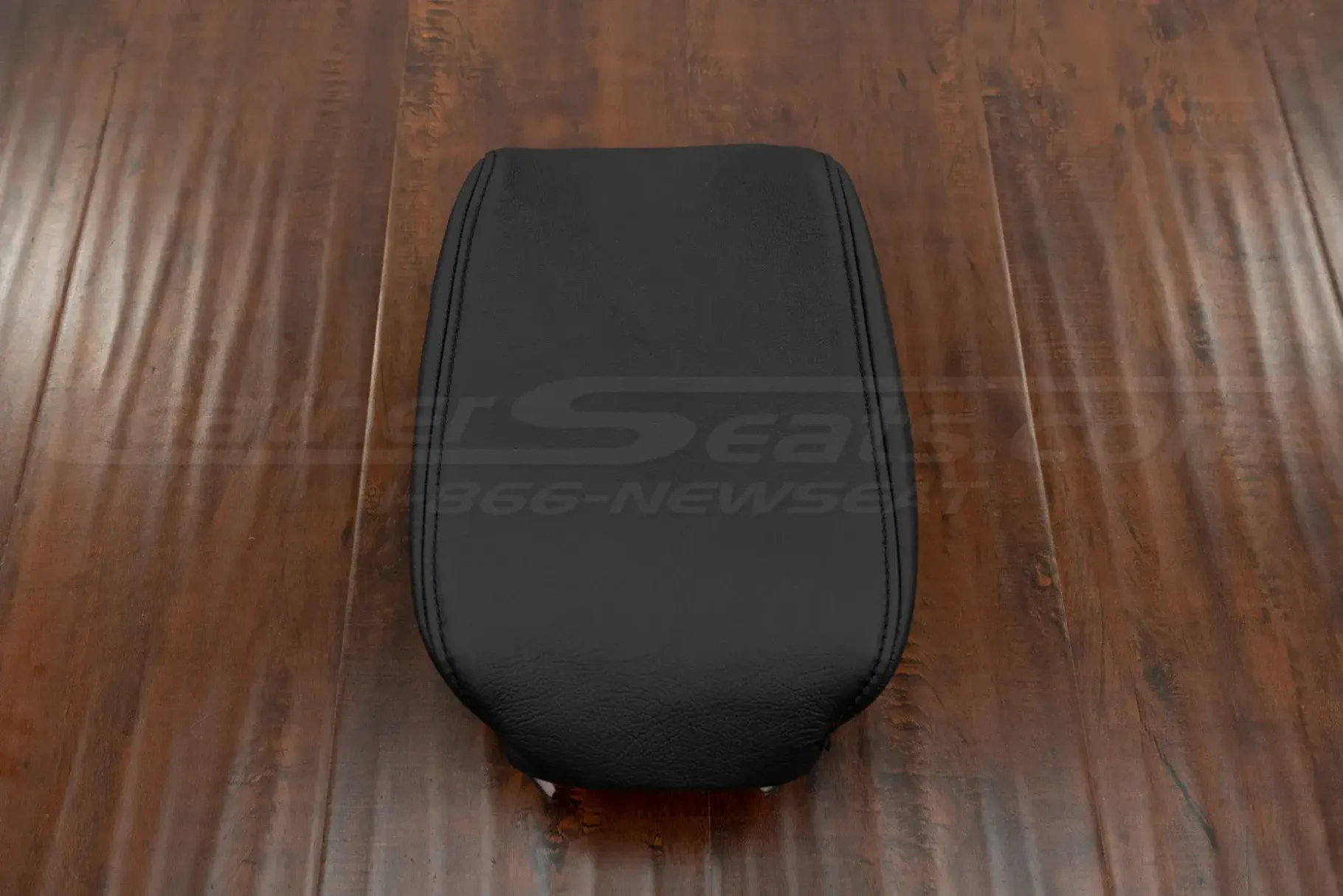 Front view of aftermarket leather console lid cover upholstery