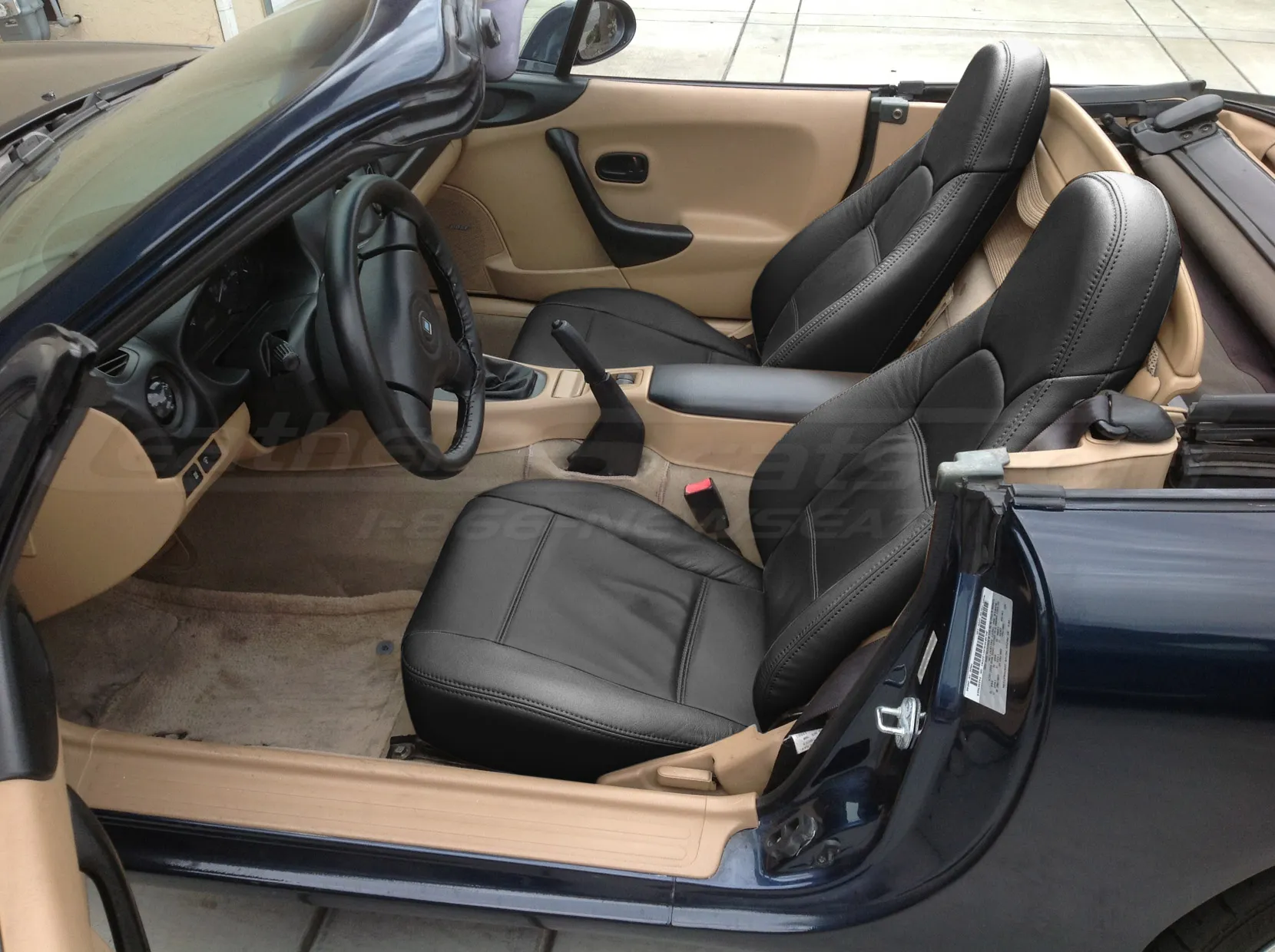 Installed Black leather seats in mazda miata