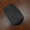 Flat lay view of black leather console lid cover