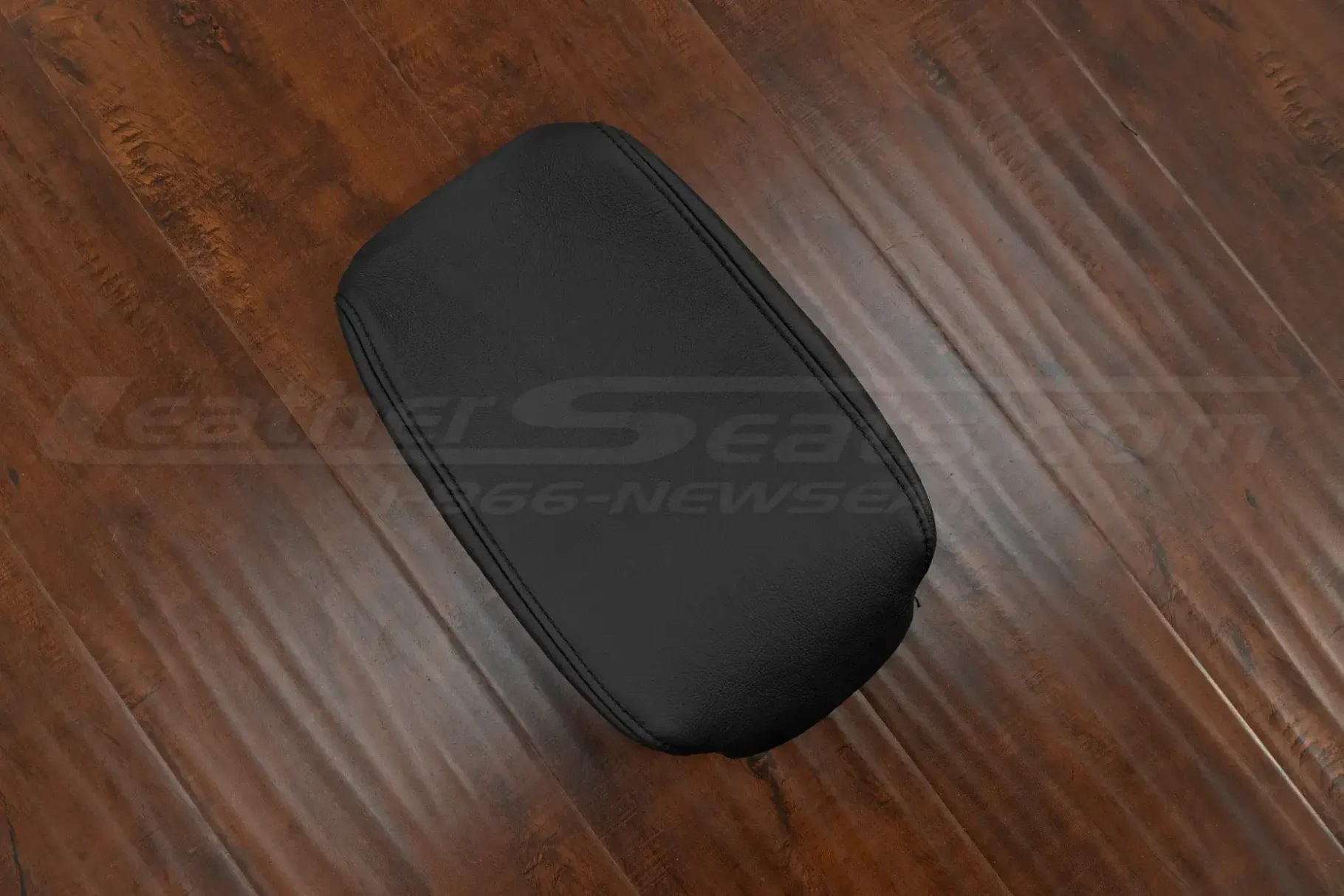 Flat lay view of black leather console lid cover