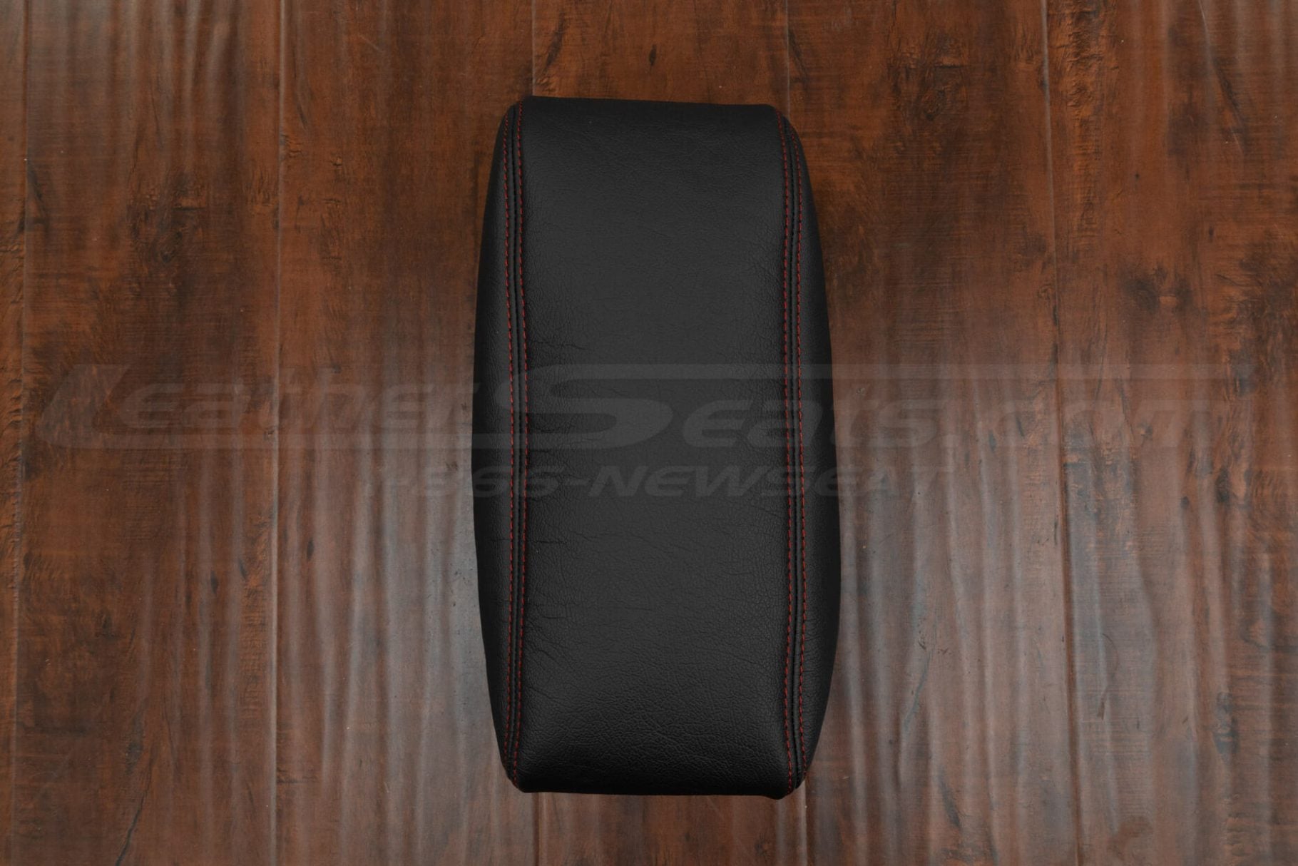 Top-down view of aftermarket leather console upholstery for durango