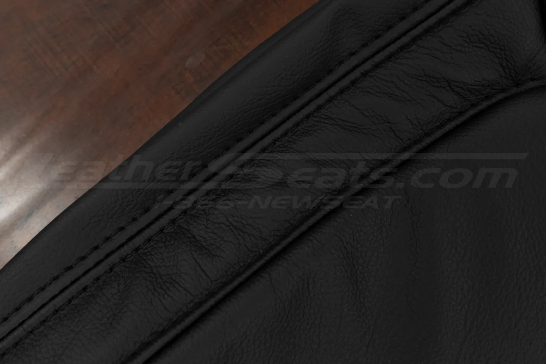 Black double-stitching on matching Black leather