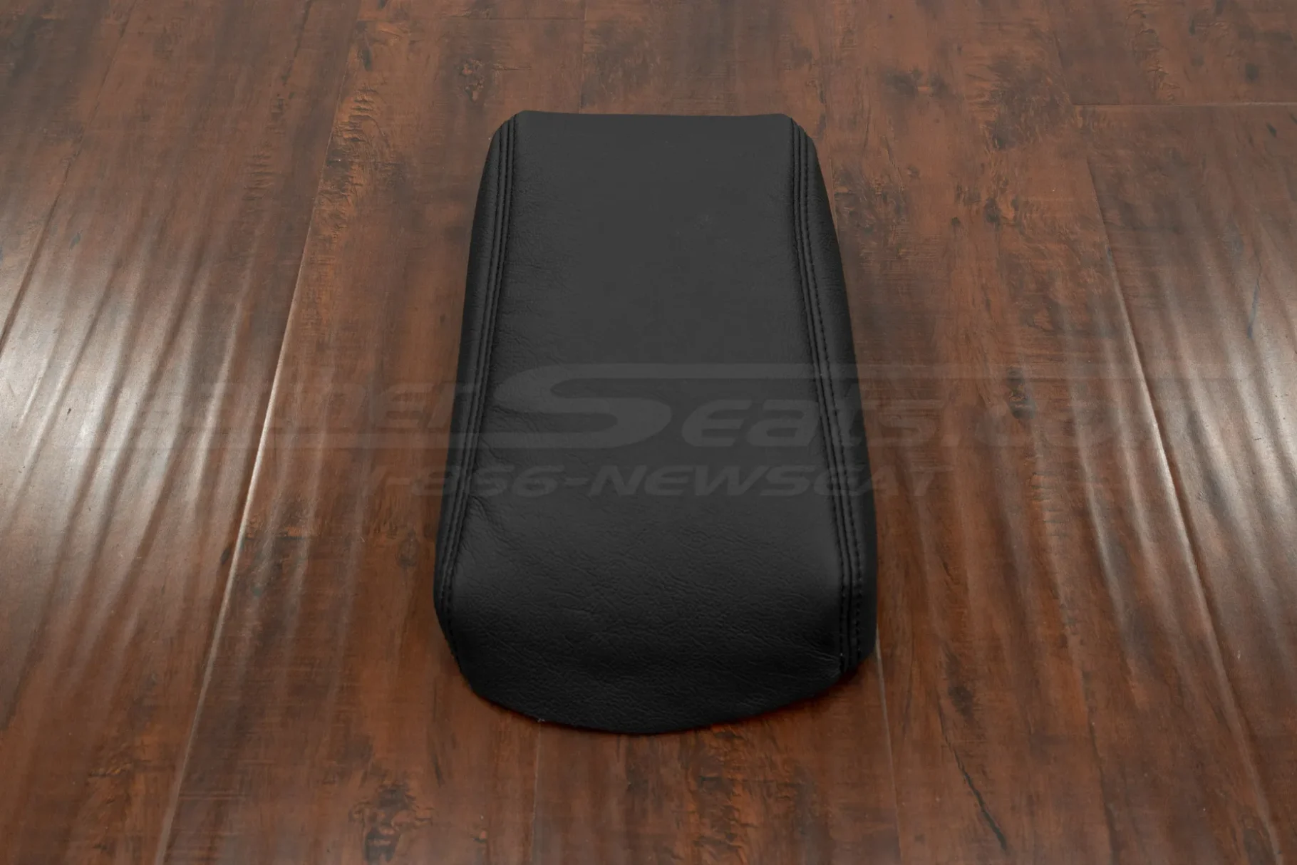Front view of black leahter console lid cover upholstery