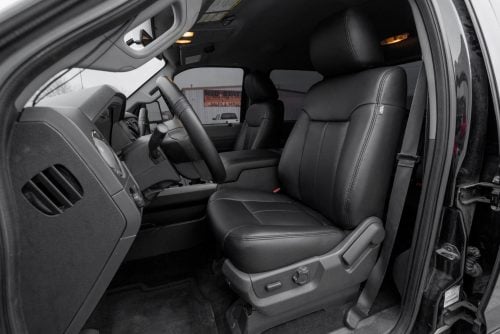 2011-2016 Ford SuperDuty with aftermarket black leather seats and black stitching