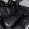 Passenger side view of Chevy Equinox with custom black leather seats and black stitching