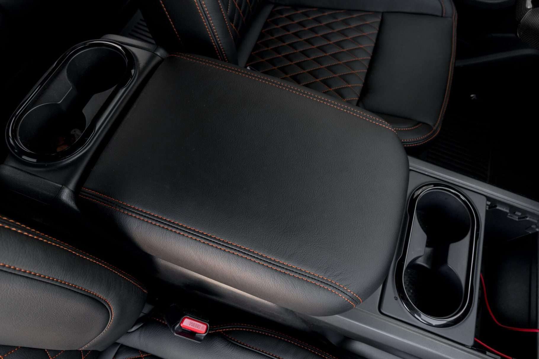 Aftermarket black leather center console lid cover for Nissan Titan
