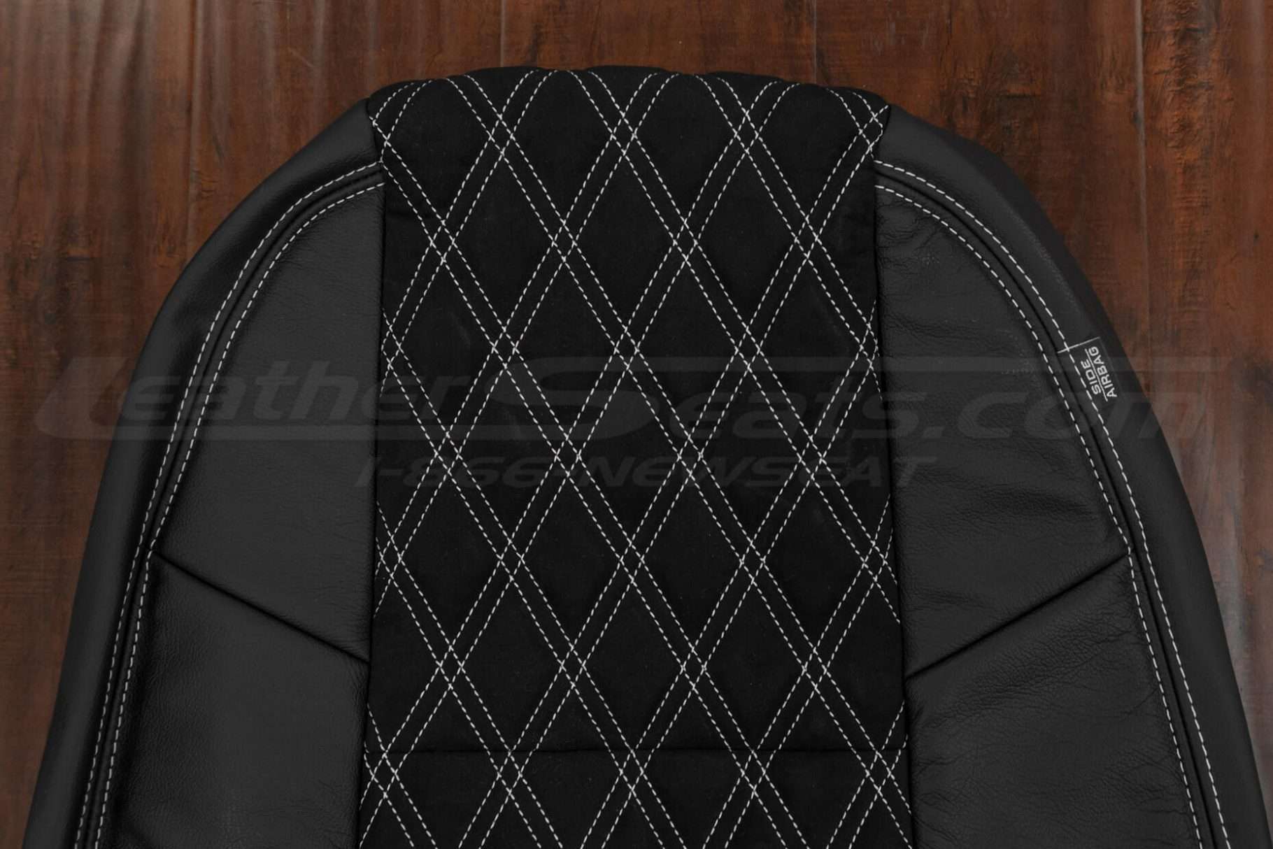 Upper section of Black and Black Suede leather backrest with white stitching