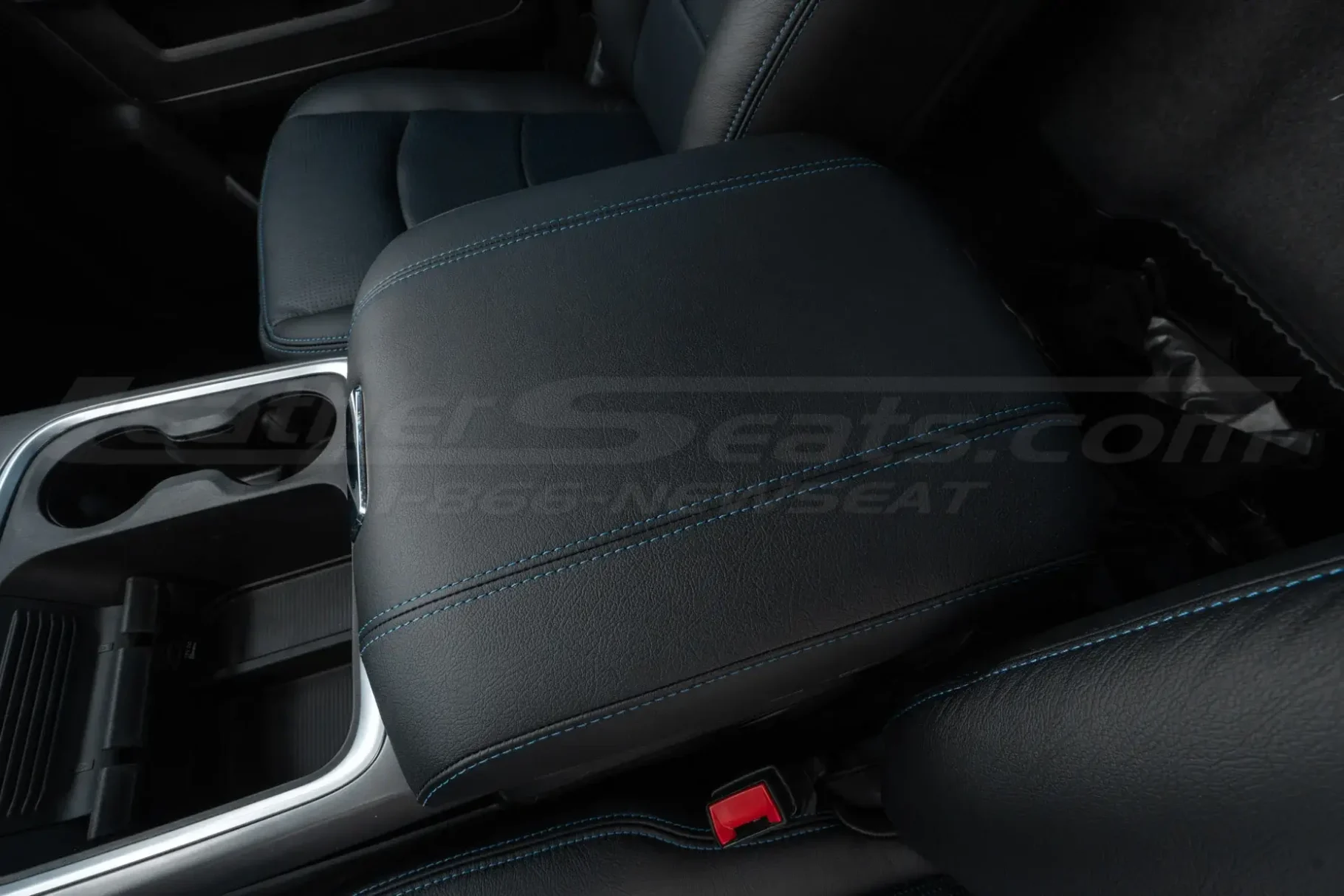 Aftermarket Dodge Ram leather center console in black with cobalt blue stitching
