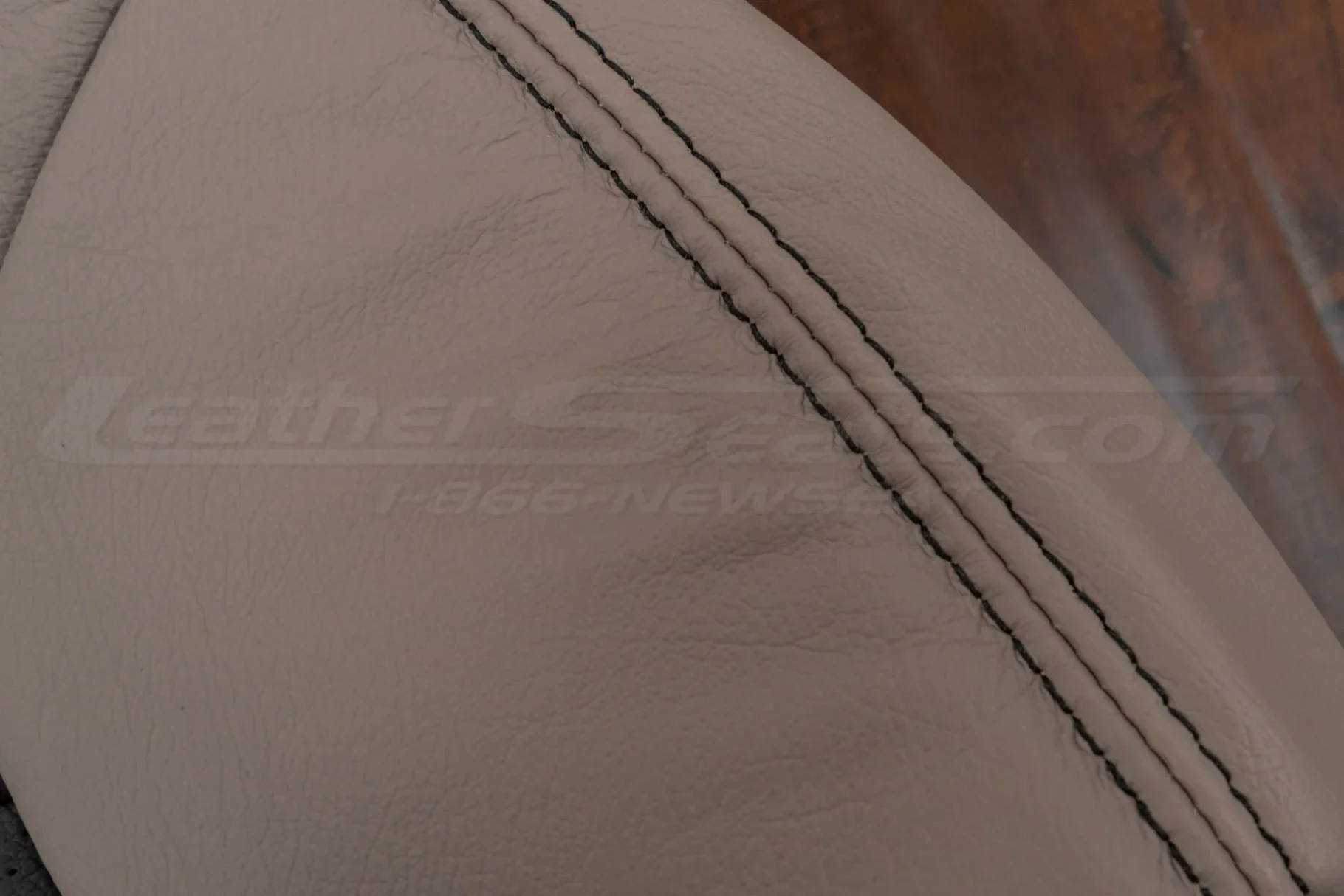 Contrasting Dark Graphite double-stitching on Fawn leather