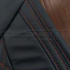 Contrastng Tangerine double-stitching on blue leather