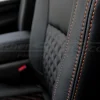 Contrast Copperhead Orange double-stitching on Black leather