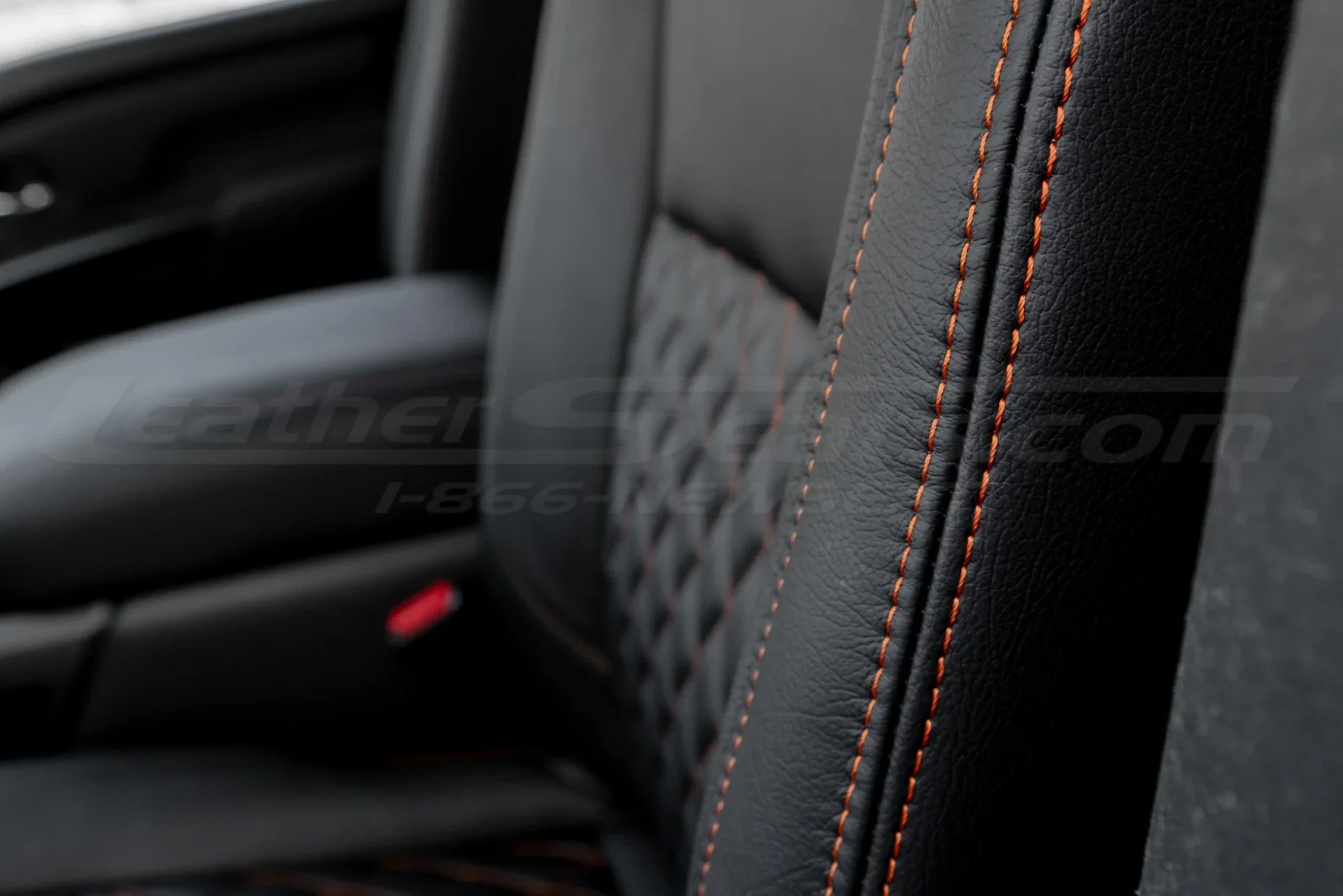 Contrast Copperhead Orange double-stitching on Black leather