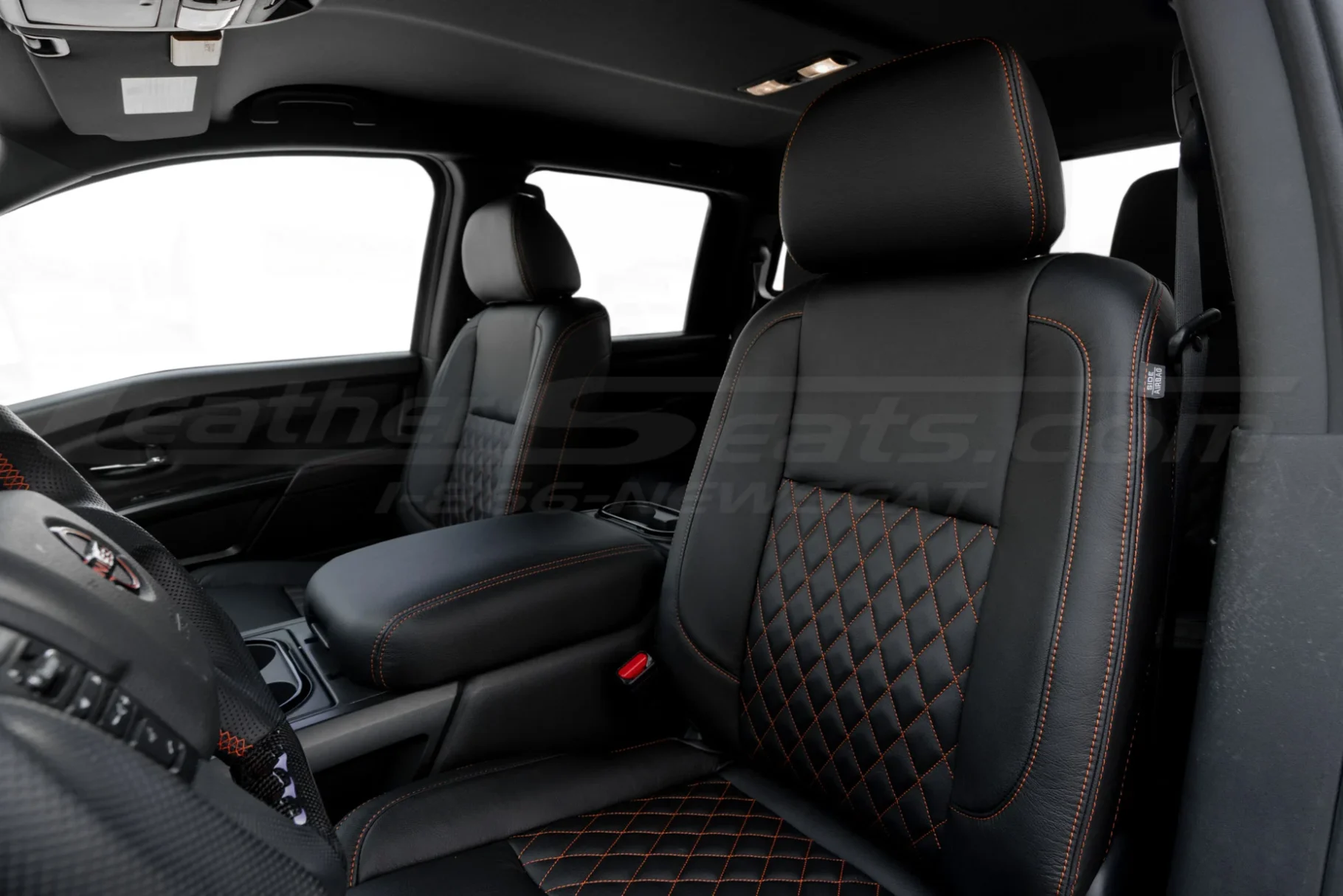 Medium shot of Black diamond quilted replacement leather seat covers installed in Nissan Titan