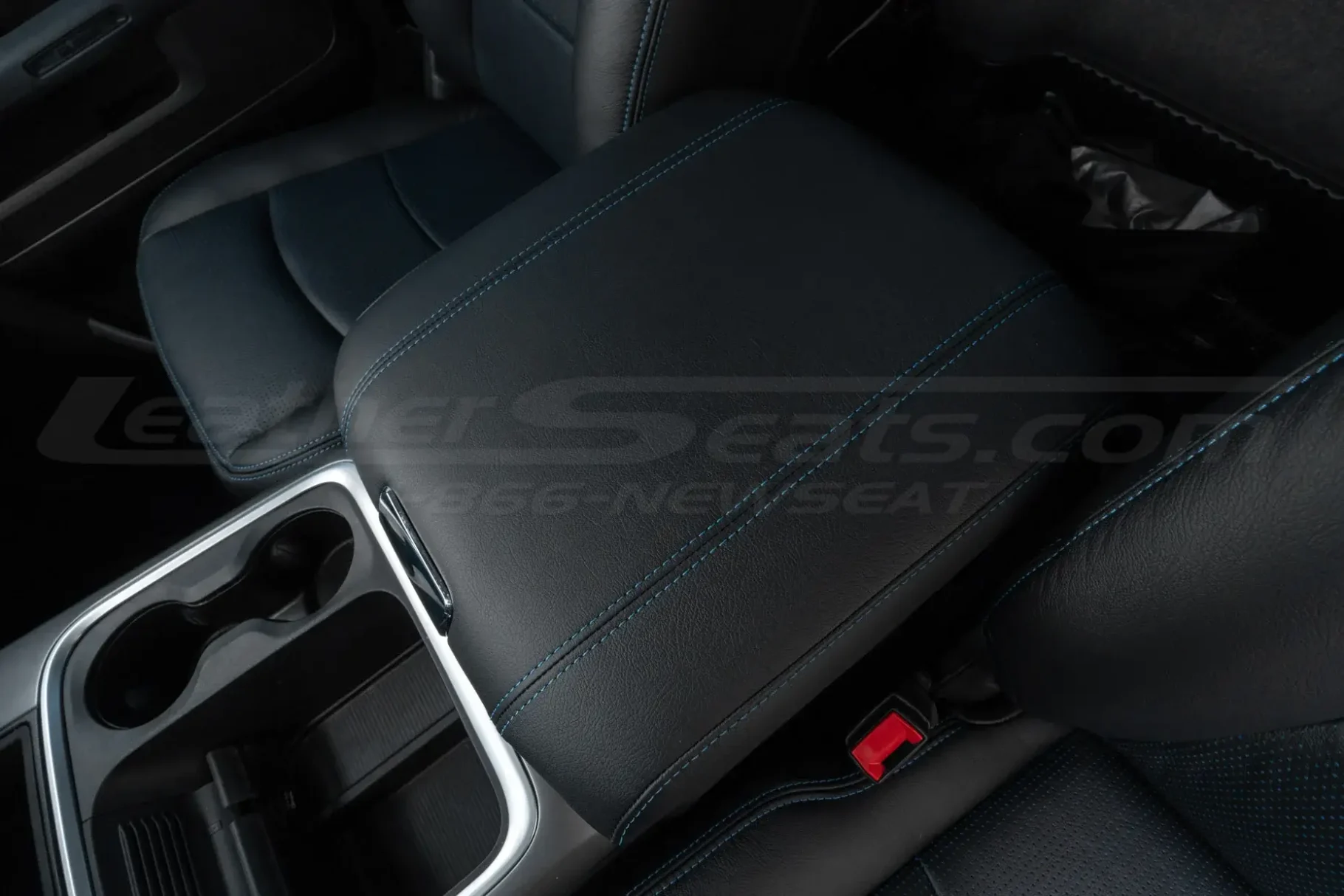 Dodge Ram Classic custom black leather console cover installed with blue stitching