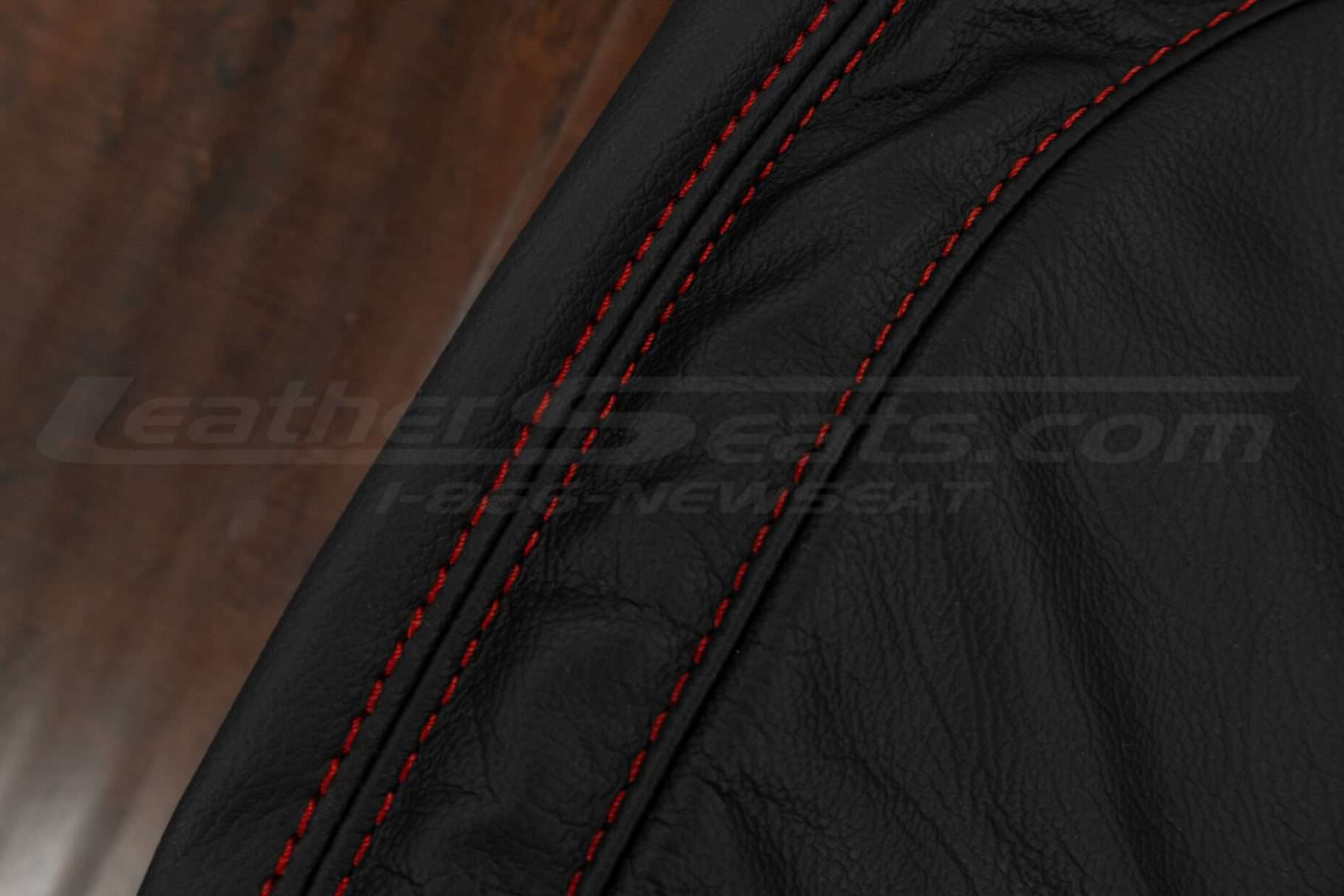 Contrast Red double-stitching on black leather